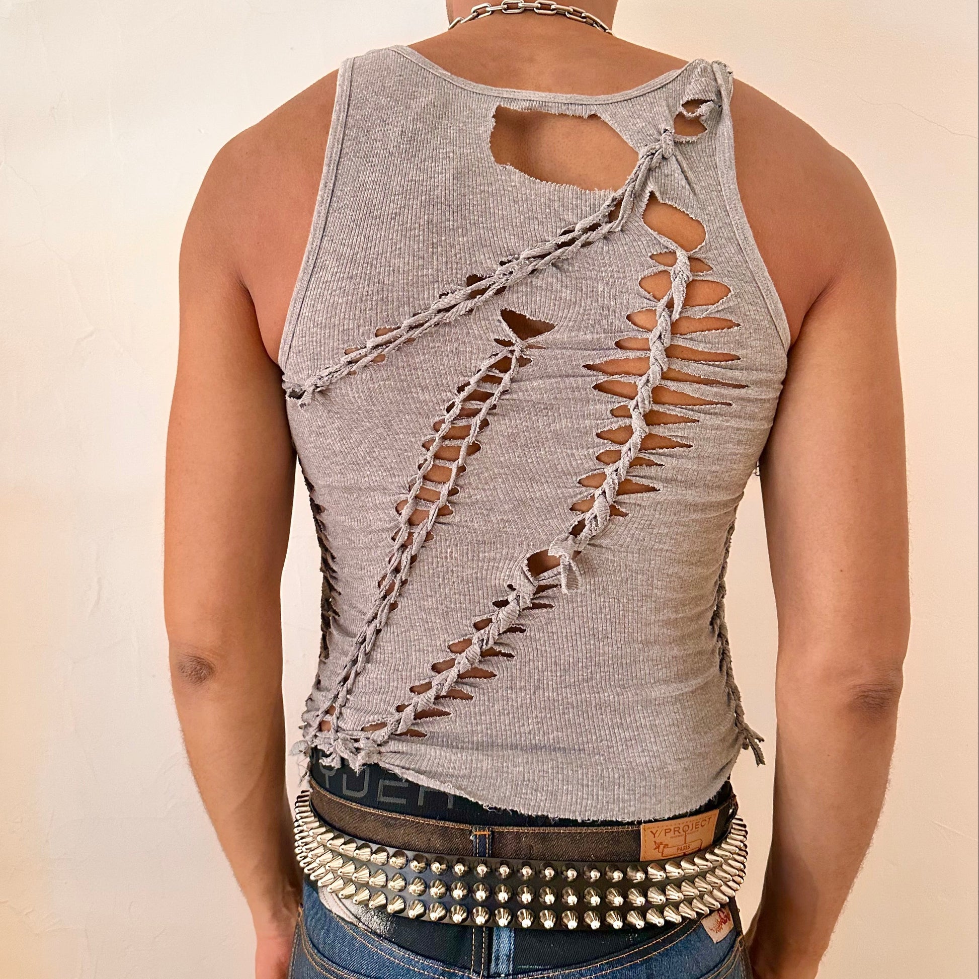 ASTROBOI* 'Morpheus' gray braided twist tank top, rear view showing braid, knot, and cut-out construction, worn by male model.