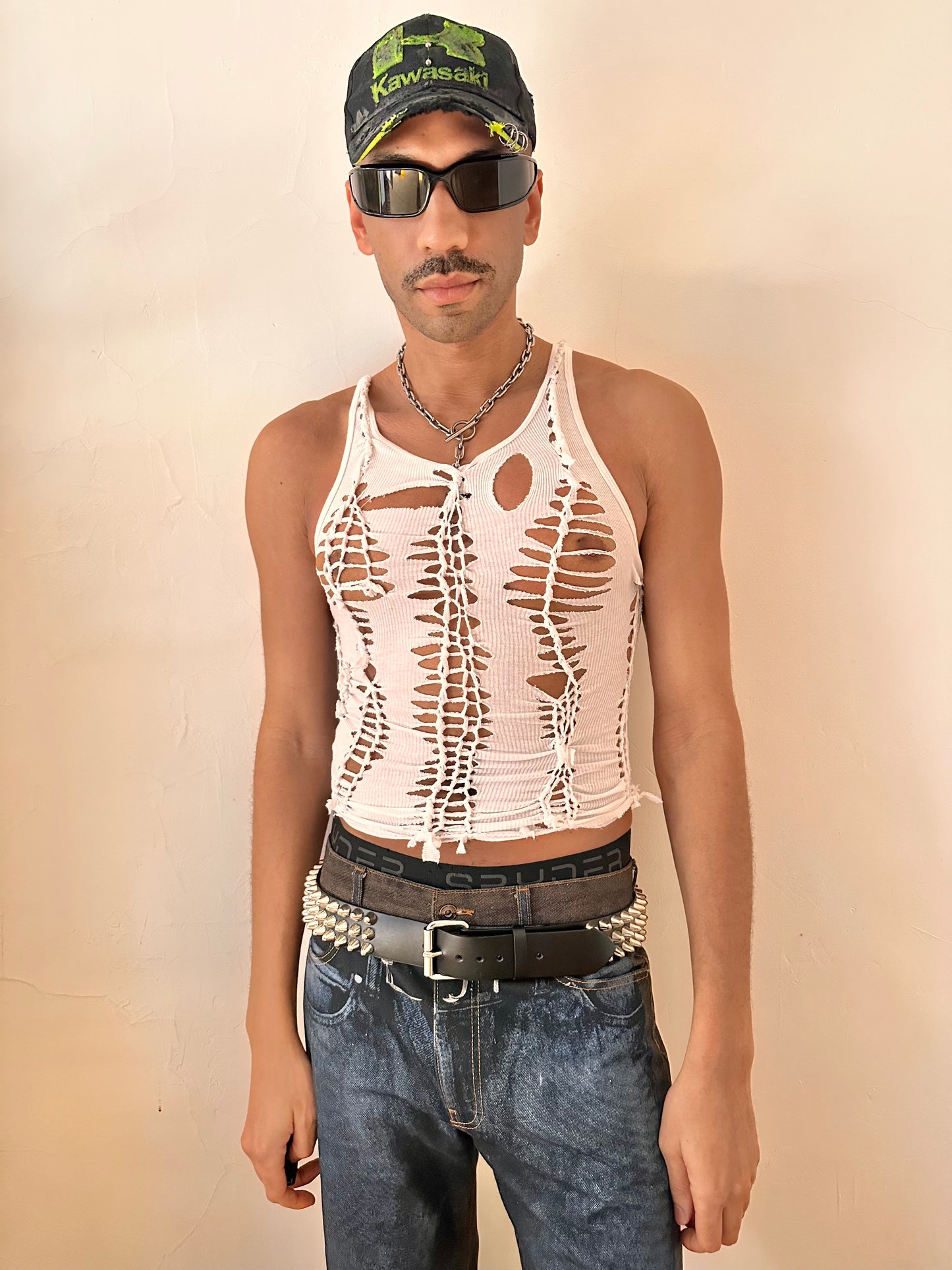 Male model wearing ASTROBOI* 'Trinity' white braided twist tank top, styled full look, ASTROBOI* STUDIO NYC.