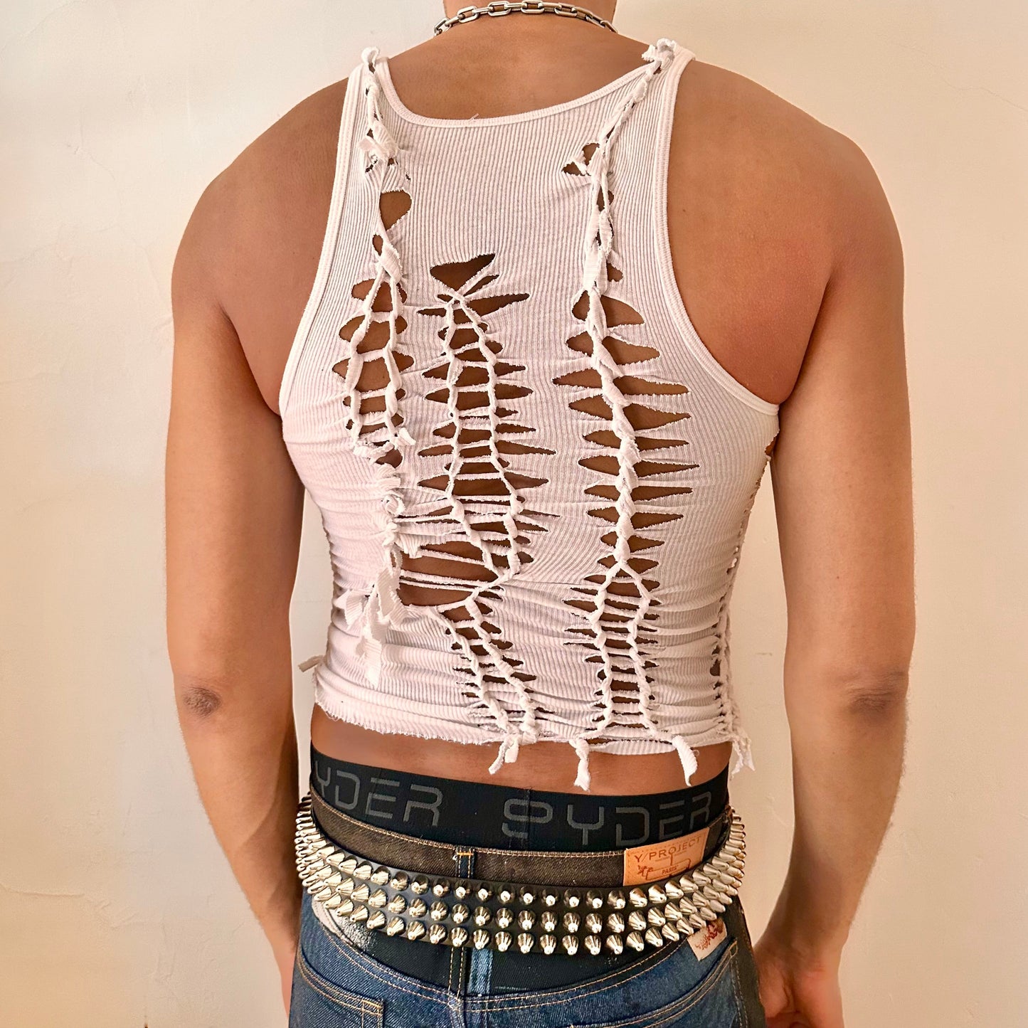 ASTROBOI* 'Trinity' white braided twist tank top, rear view showing braid and cut-out construction, worn by male model.