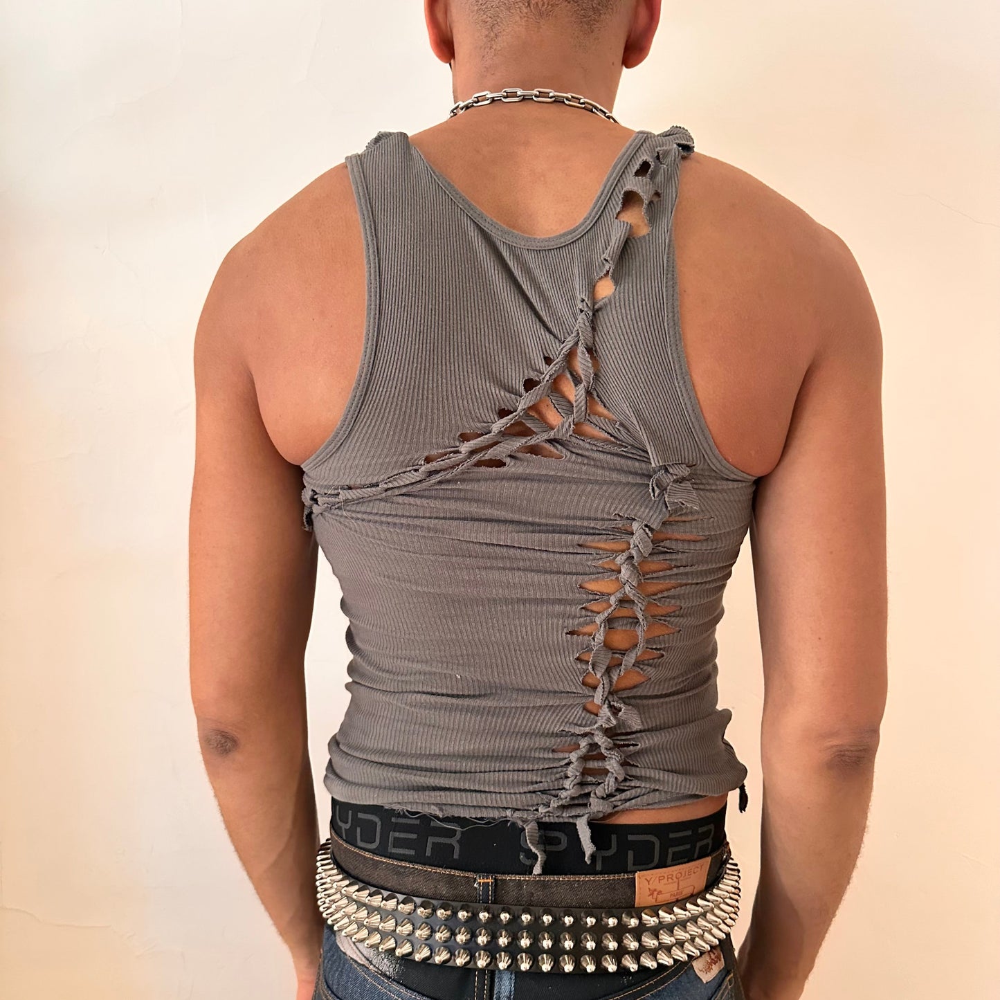 Back of ASTROBOI* 'Cypher' clay gray slim-fit tank top with hand-braided twist detailing and cut-outs contouring the torso, handmade at ASTROBOI* STUDIO in NYC.