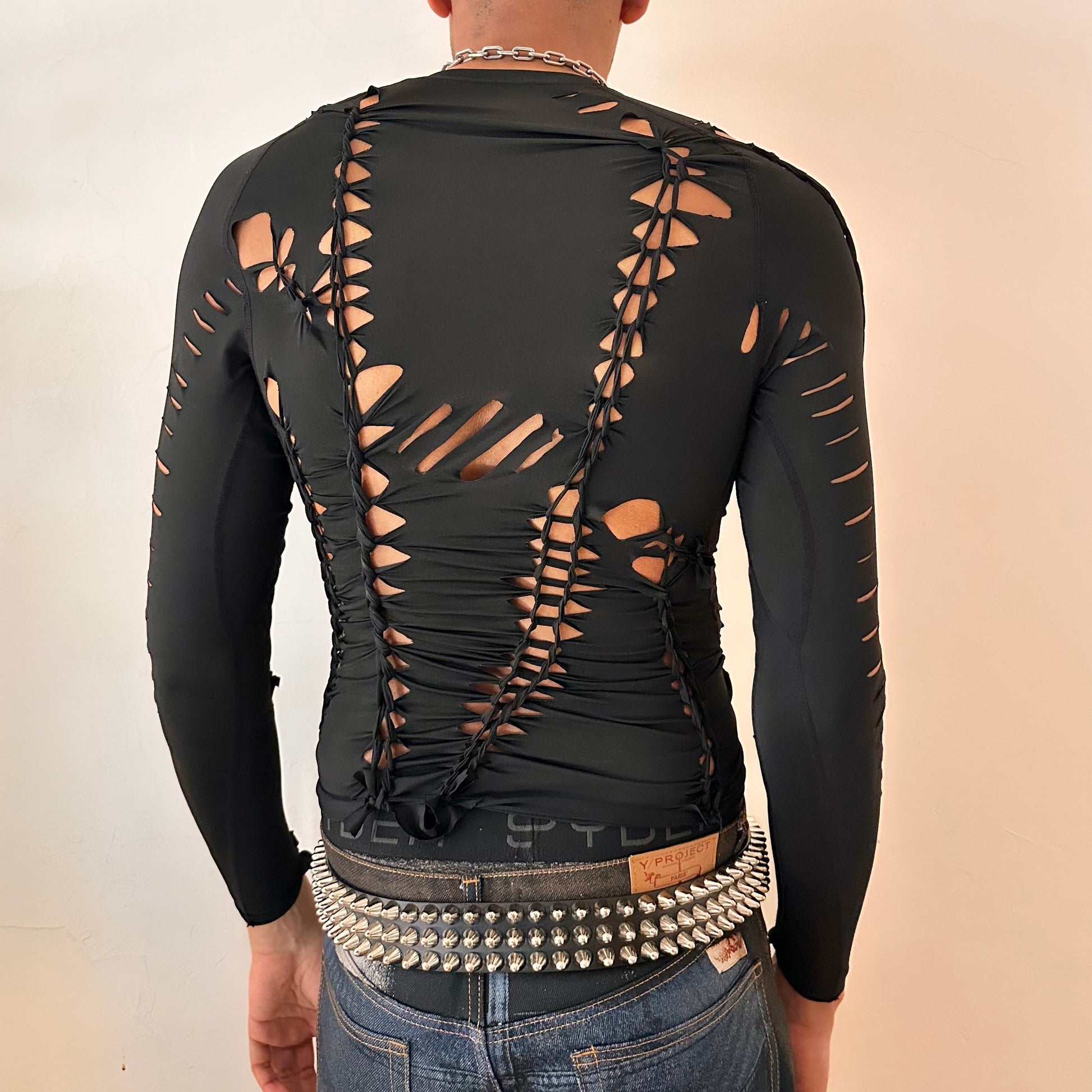 ASTROBOI* 'LEO' black long sleeve braided spandex compression top, rear view showing braid and slash construction, worn by male model.