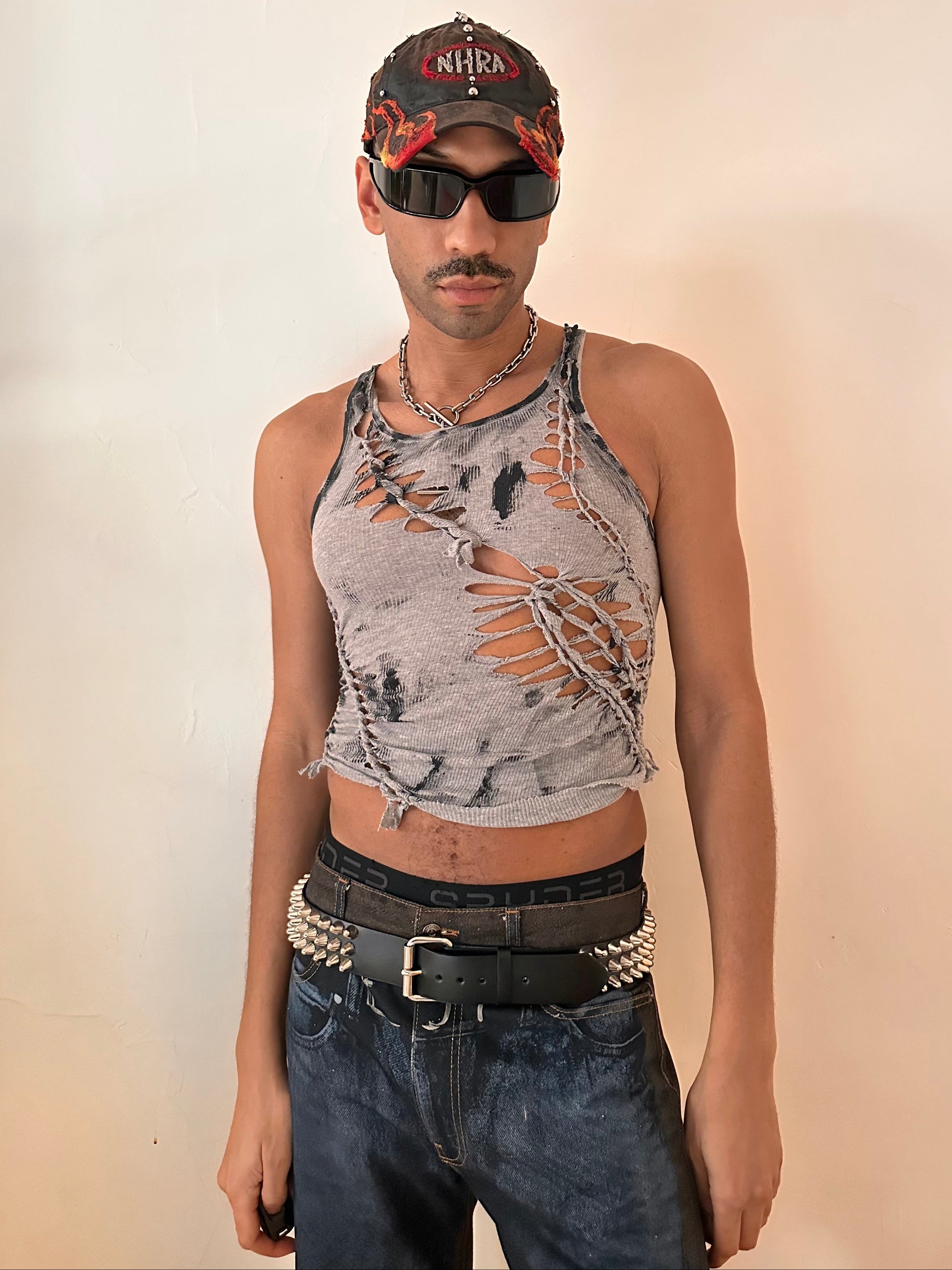 Male model wearing ASTROBOI* 'Hybrid' gray and black painted braided twist tank top, styled full look, ASTROBOI* STUDIO NYC.