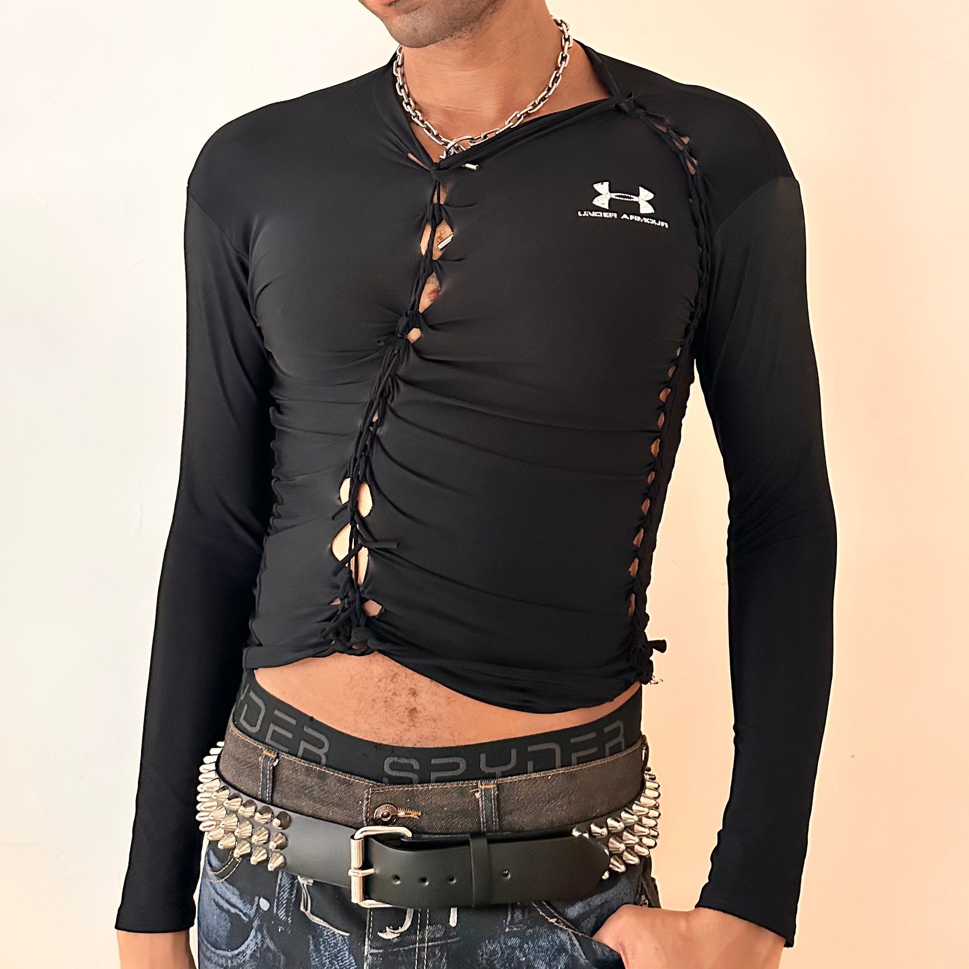 Cover image of ASTROBOI* x Under Armour black braided compression top in large with slim stretch fit, twist detailing, and UA logos at chest and back.
