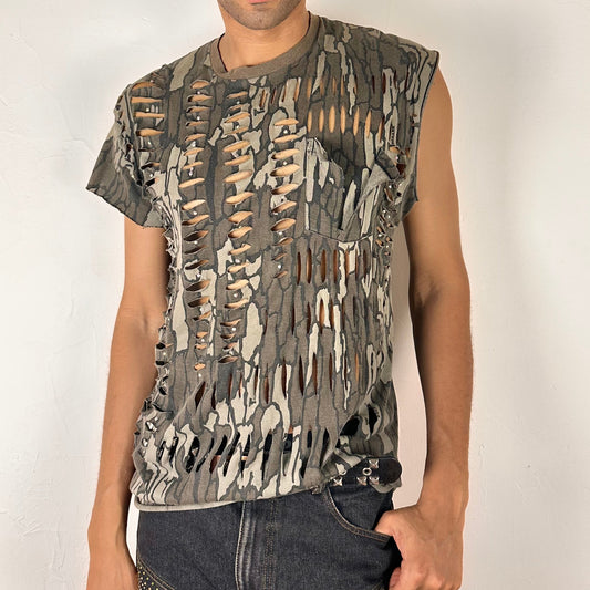 ASTROBOI* 'Maelstrom' Real Tree camo loose-fitting tank top with rainbow rhinestone embellishments throughout and deconstructed pocket detail at front, front view.