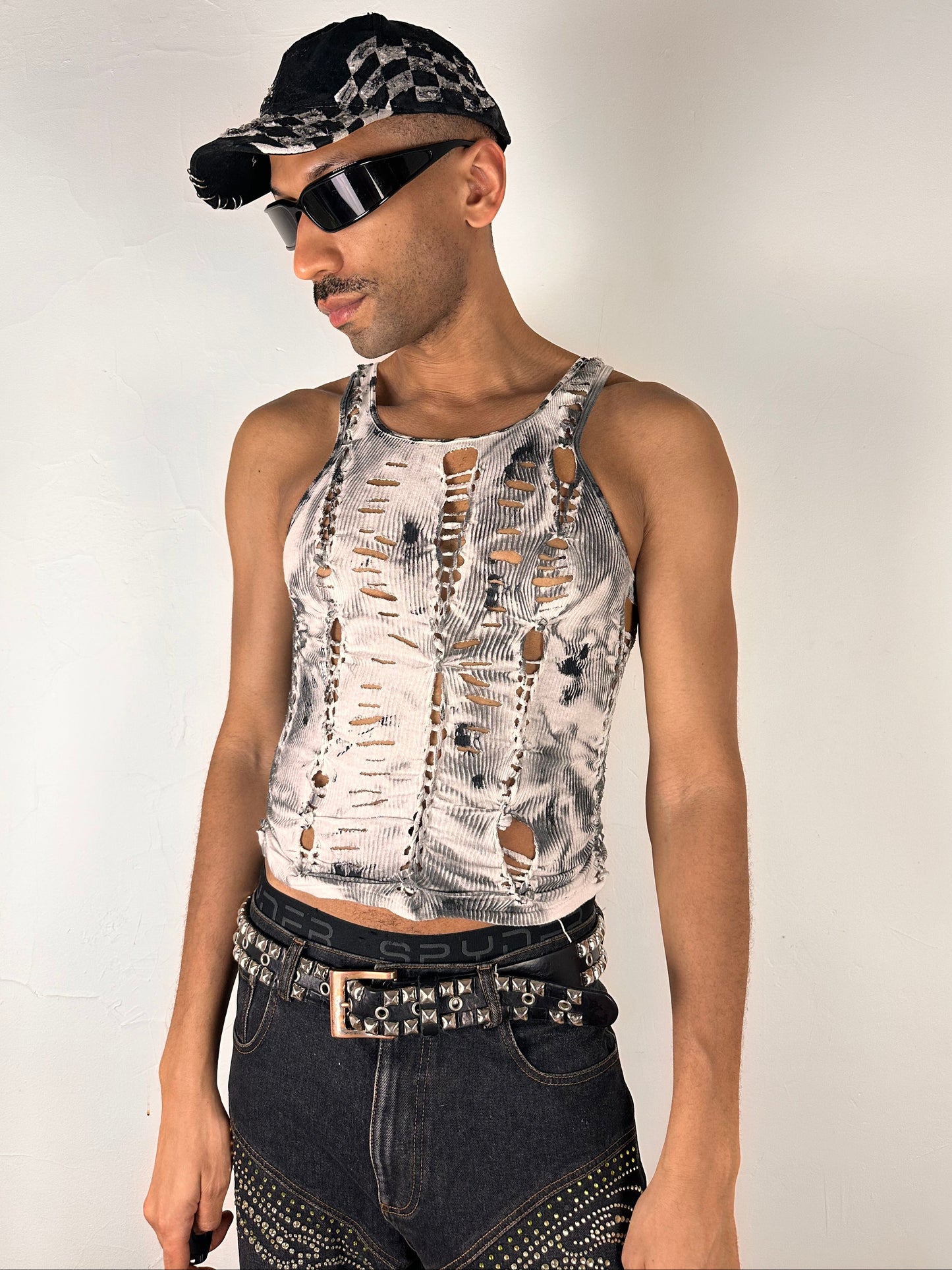 Male model wearing ASTROBOI* 'Theia' white and black braided twist top, styled full look, ASTROBOI* STUDIO NYC.