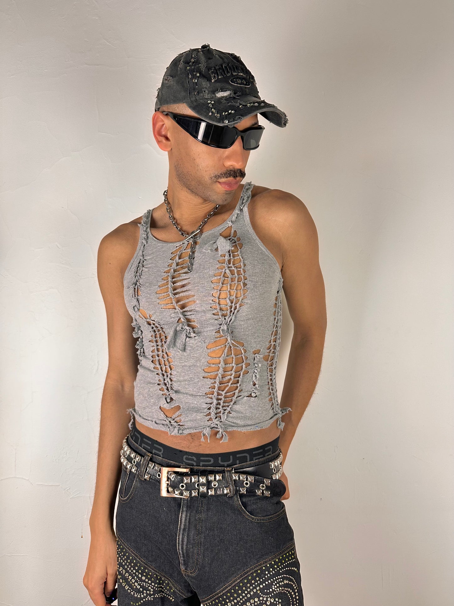 Male model wearing ASTROBOI* 'Smoke' gray braided twist tank top, styled full look, ASTROBOI* STUDIO NYC.