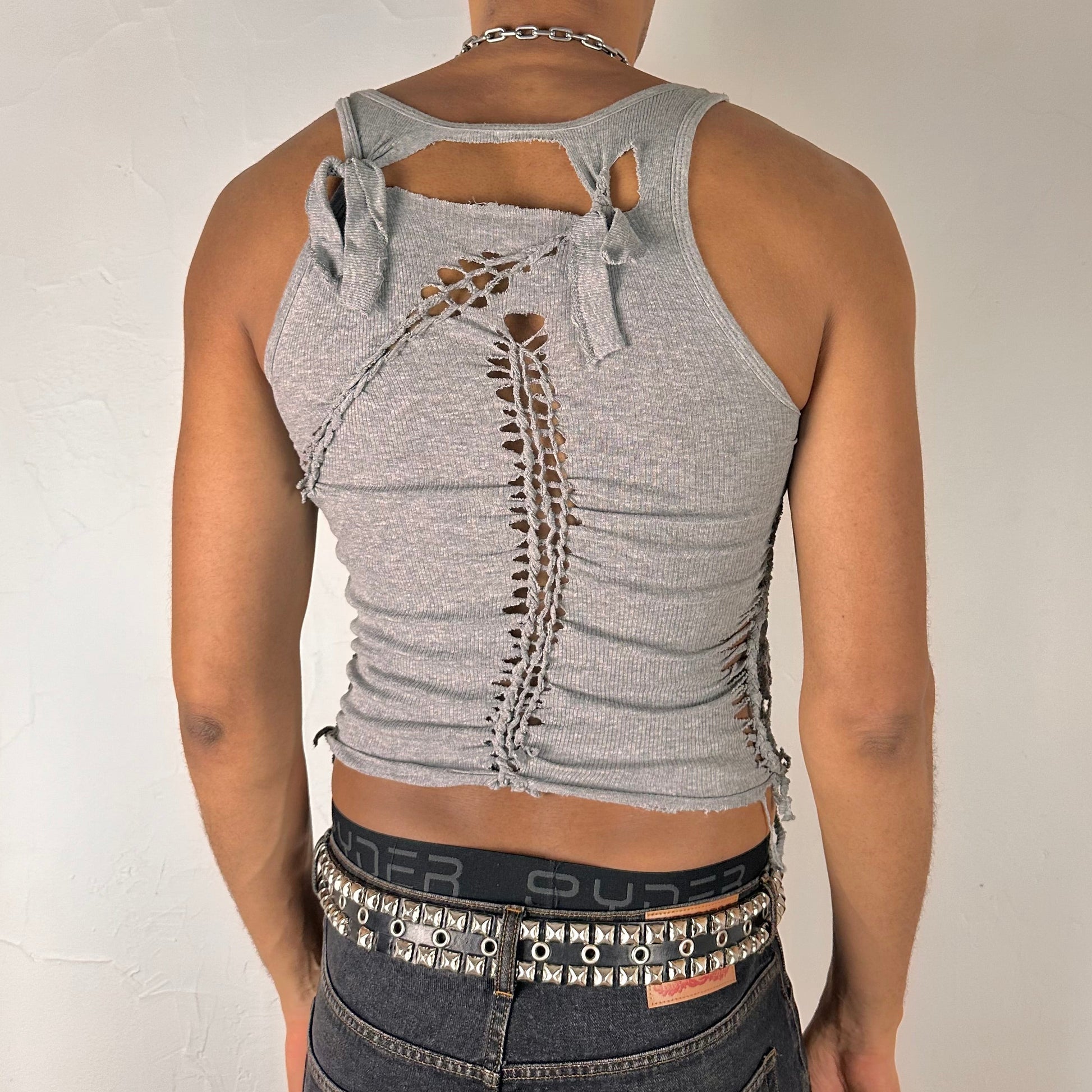 ASTROBOI* 'Smoke' gray braided twist tank top, rear view showing braid, knot, and cut-out construction, worn by male model.