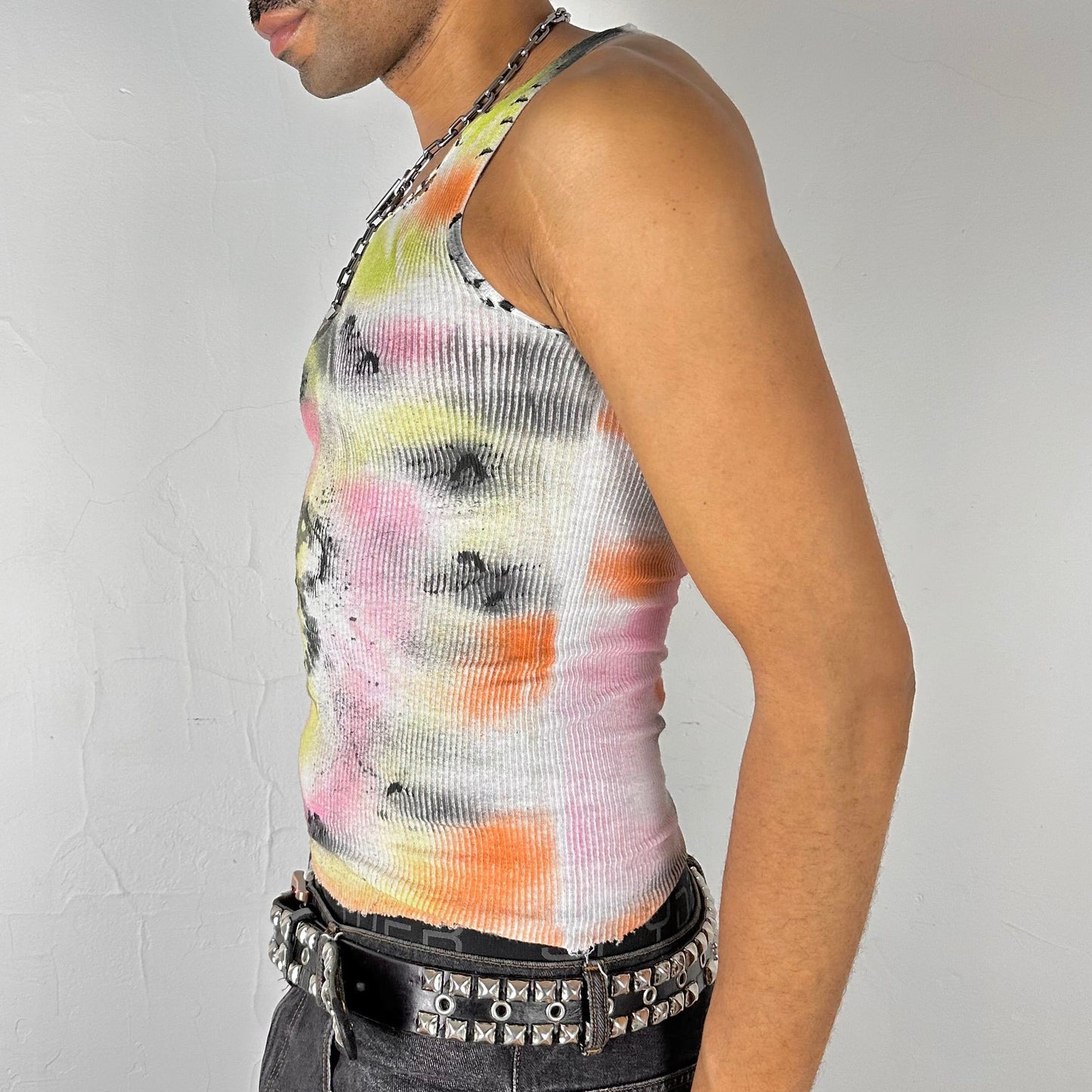 Left side of ASTROBOI* x Hanes 'Flowers' white ribbed cotton tank top with hand-painted pink and yellow floral design throughout, customized at ASTROBOI* STUDIO in NYC.