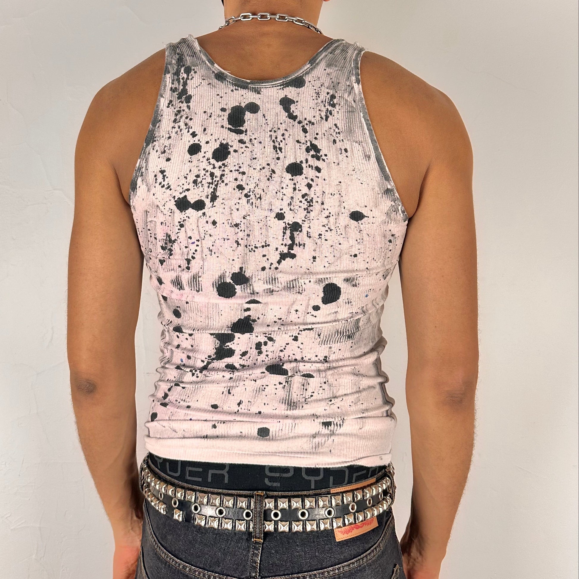 ASTROBOI* x Hanes 'Skies' white abstract graffiti tank top, rear view showing hand-painted multicolor spot and scribble design, worn by male model.