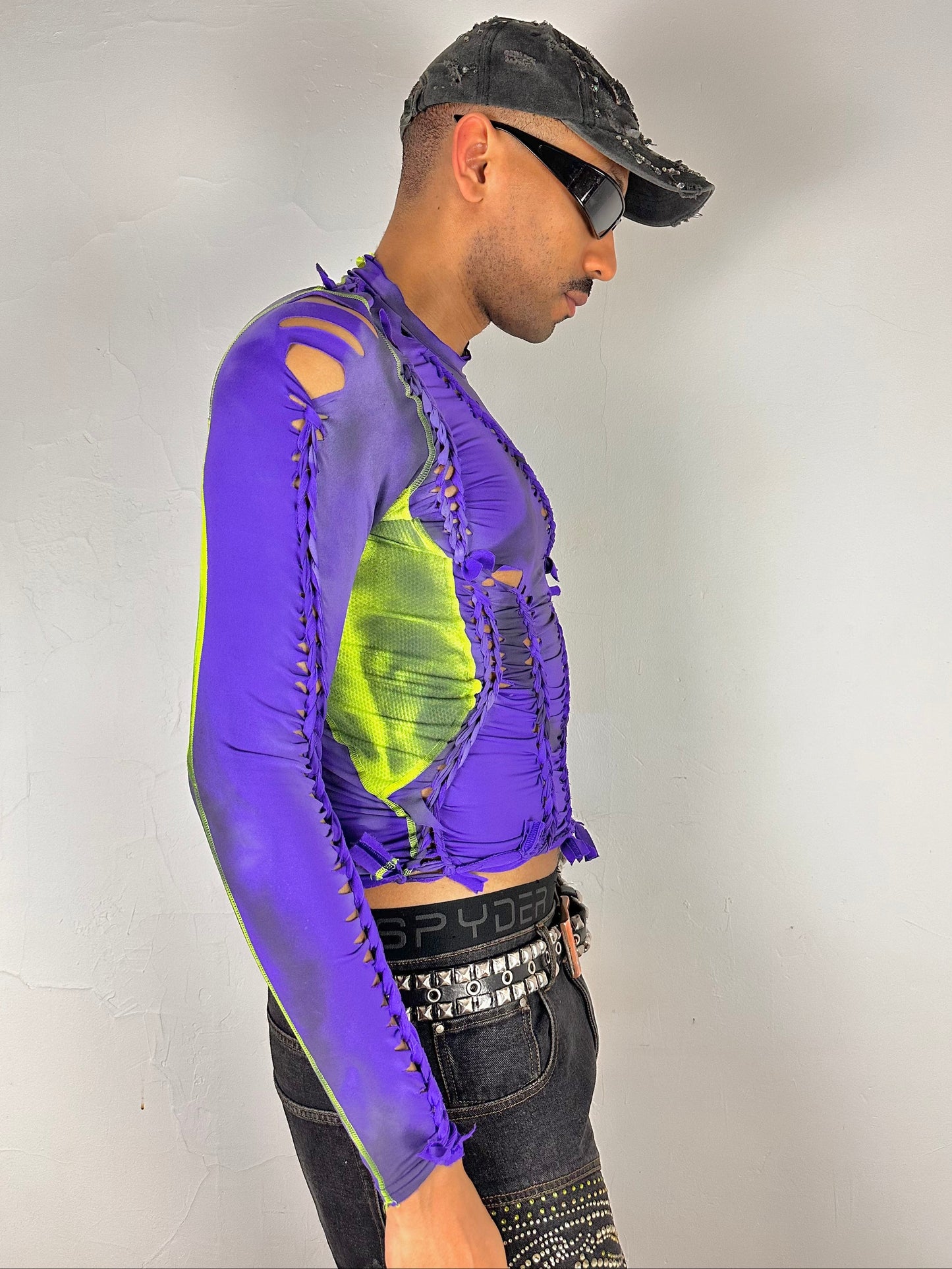 Right side of ASTROBOI* x Nike Pro purple and green braided compression top in medium with airbrushed details, mesh side panels, and slim athletic fit.