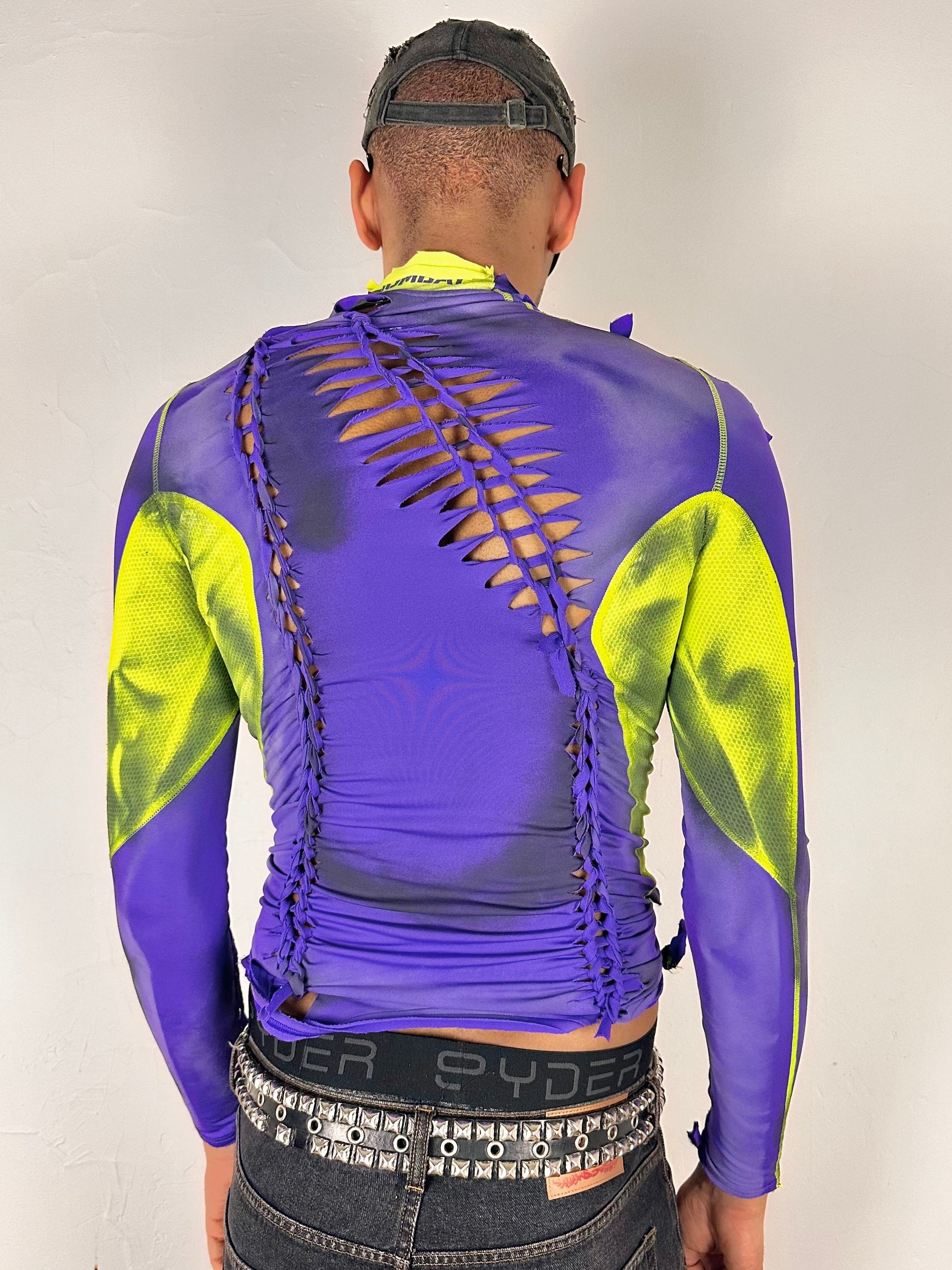 Back side of ASTROBOI* x Nike Pro purple and green braided compression top in medium with airbrushed details, mesh side panels, and slim athletic fit.