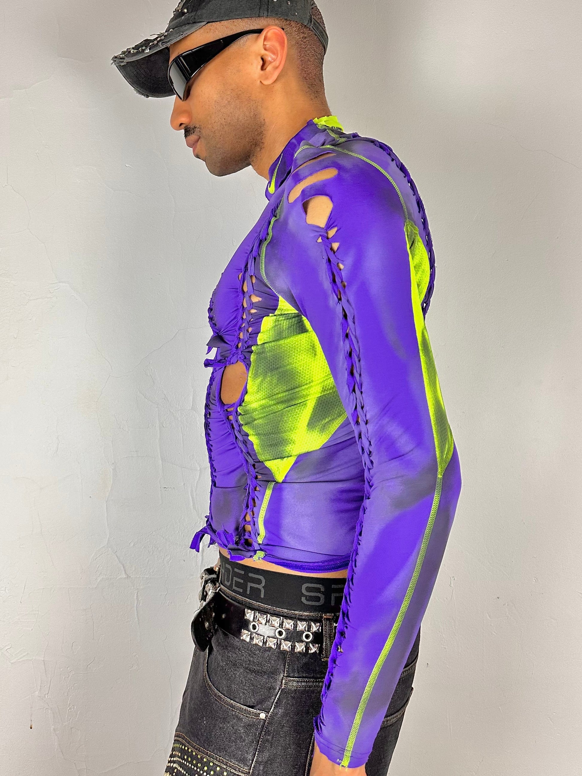 Left side of ASTROBOI* x Nike Pro purple and green braided compression top in medium with airbrushed details, mesh side panels, and slim athletic fit.