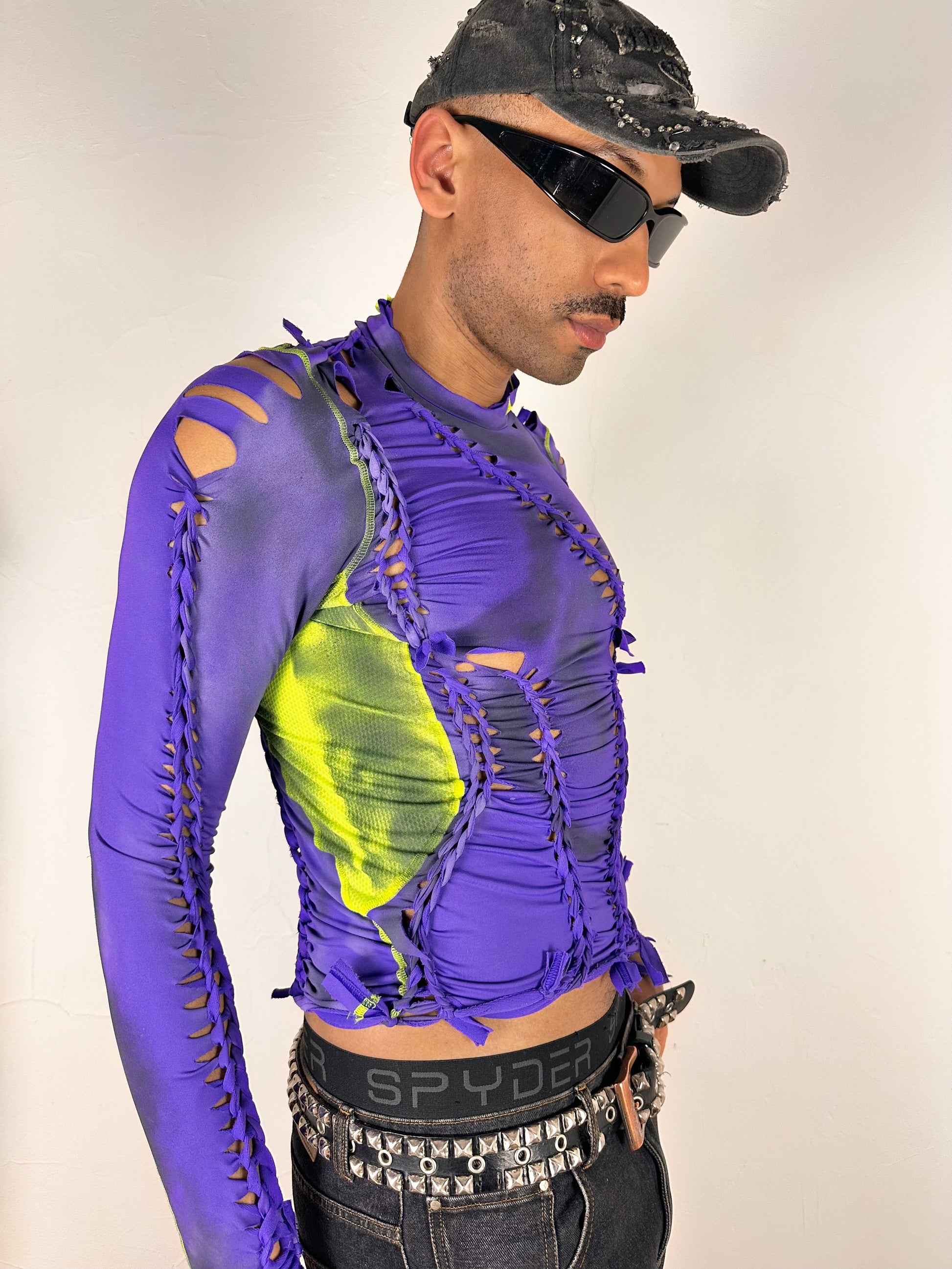 Front right side of ASTROBOI* x Nike Pro purple and green braided compression top in medium with airbrushed details, mesh side panels, and slim athletic fit.