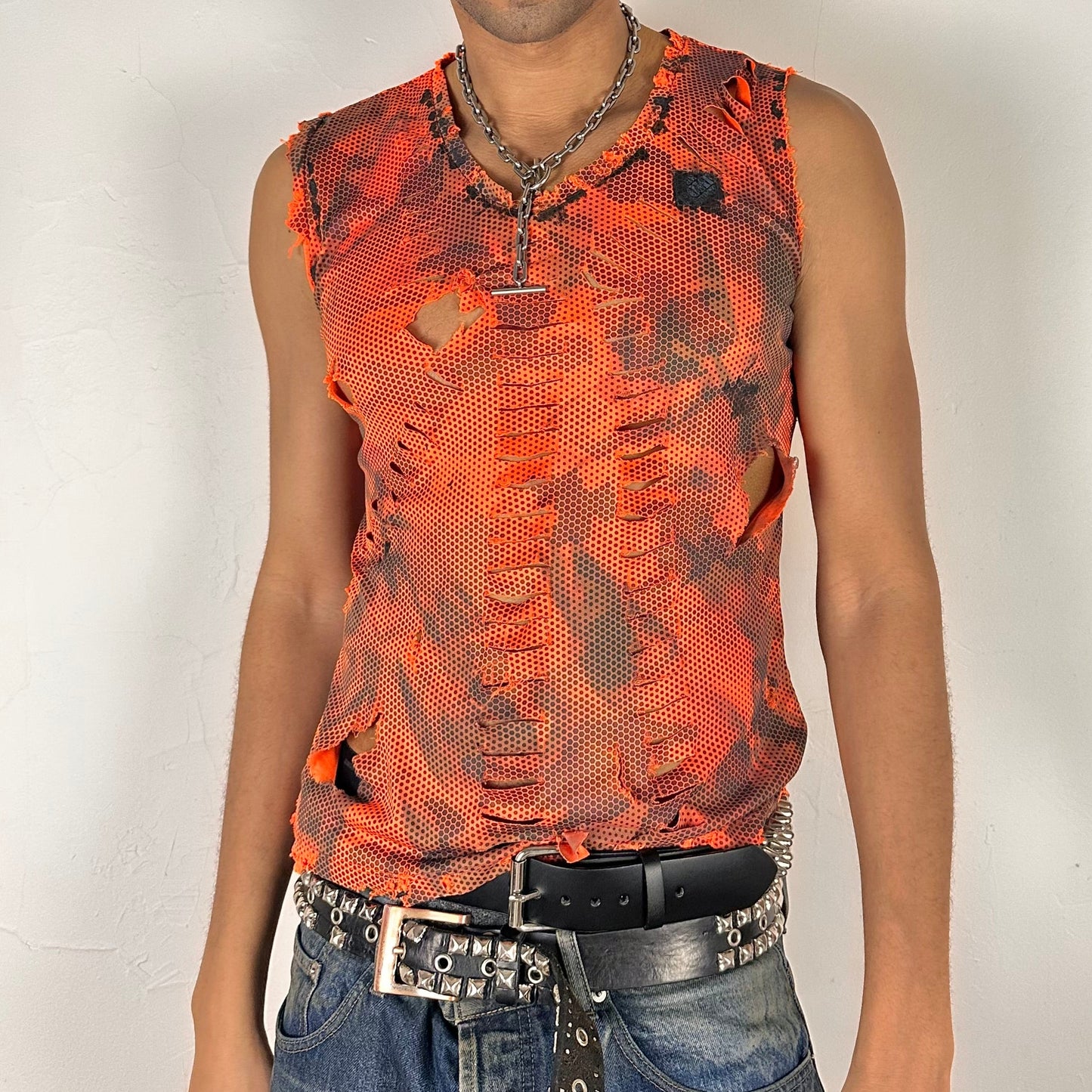 ASTROBOI* 'Home Depot' blaze orange loose-fitting grunge camo tank top with high design cuts and black and white paint treatment throughout, front view.