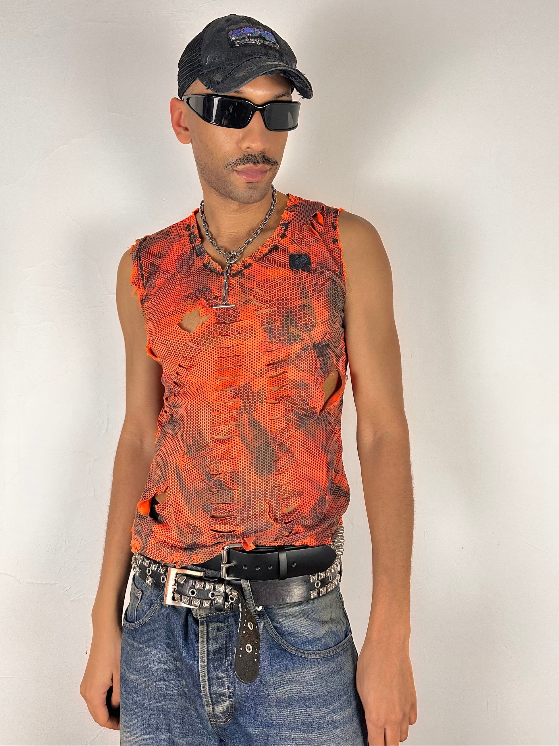 Male model wearing ASTROBOI* 'Home Depot' blaze orange grunge camo tank top, styled full look, ASTROBOI* STUDIO NYC.