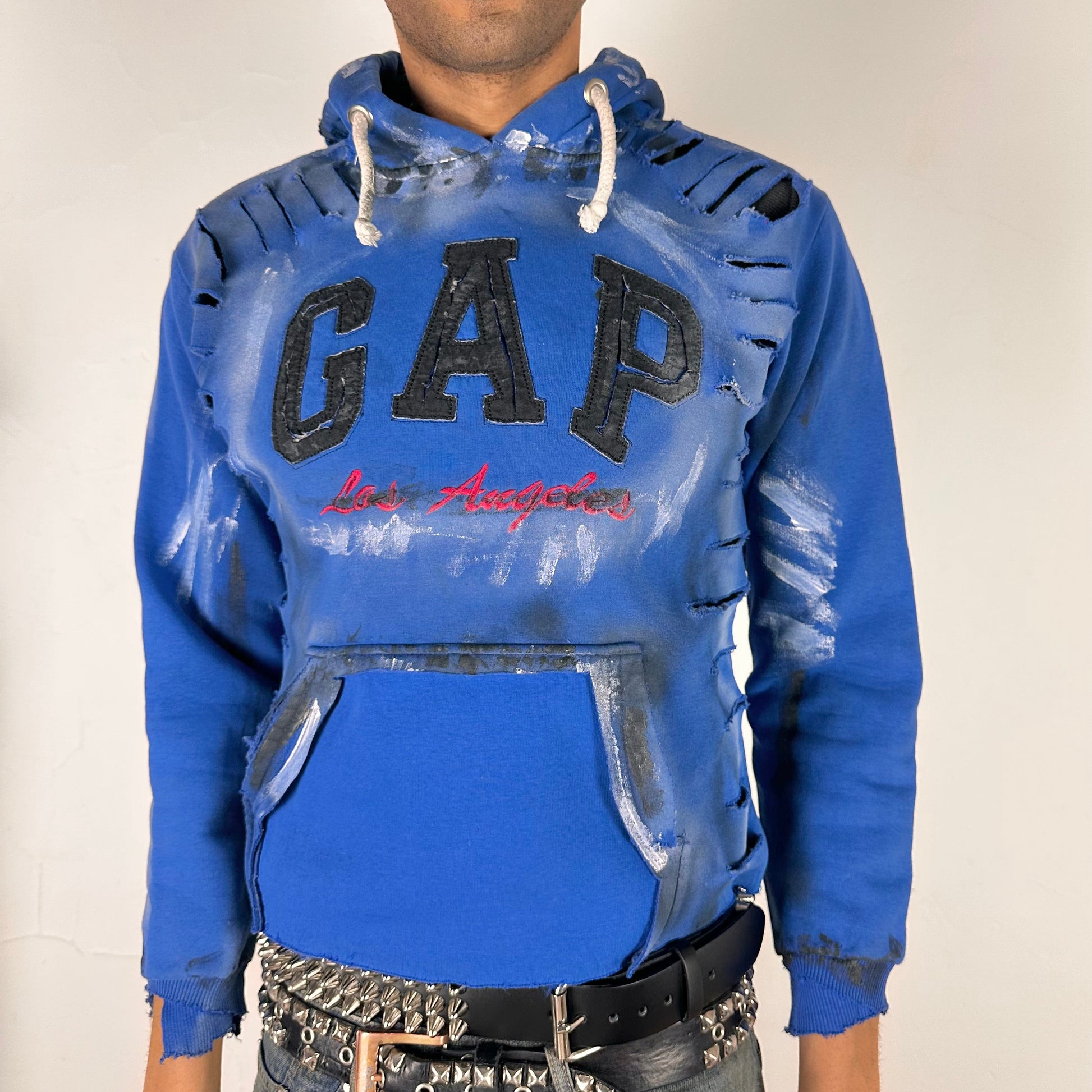 Cover image of ASTROBOI* x Gap blue distressed hoodie with airbrushed logo, ripped detailing, raw hem and rope drawcords, size Large loose fit.