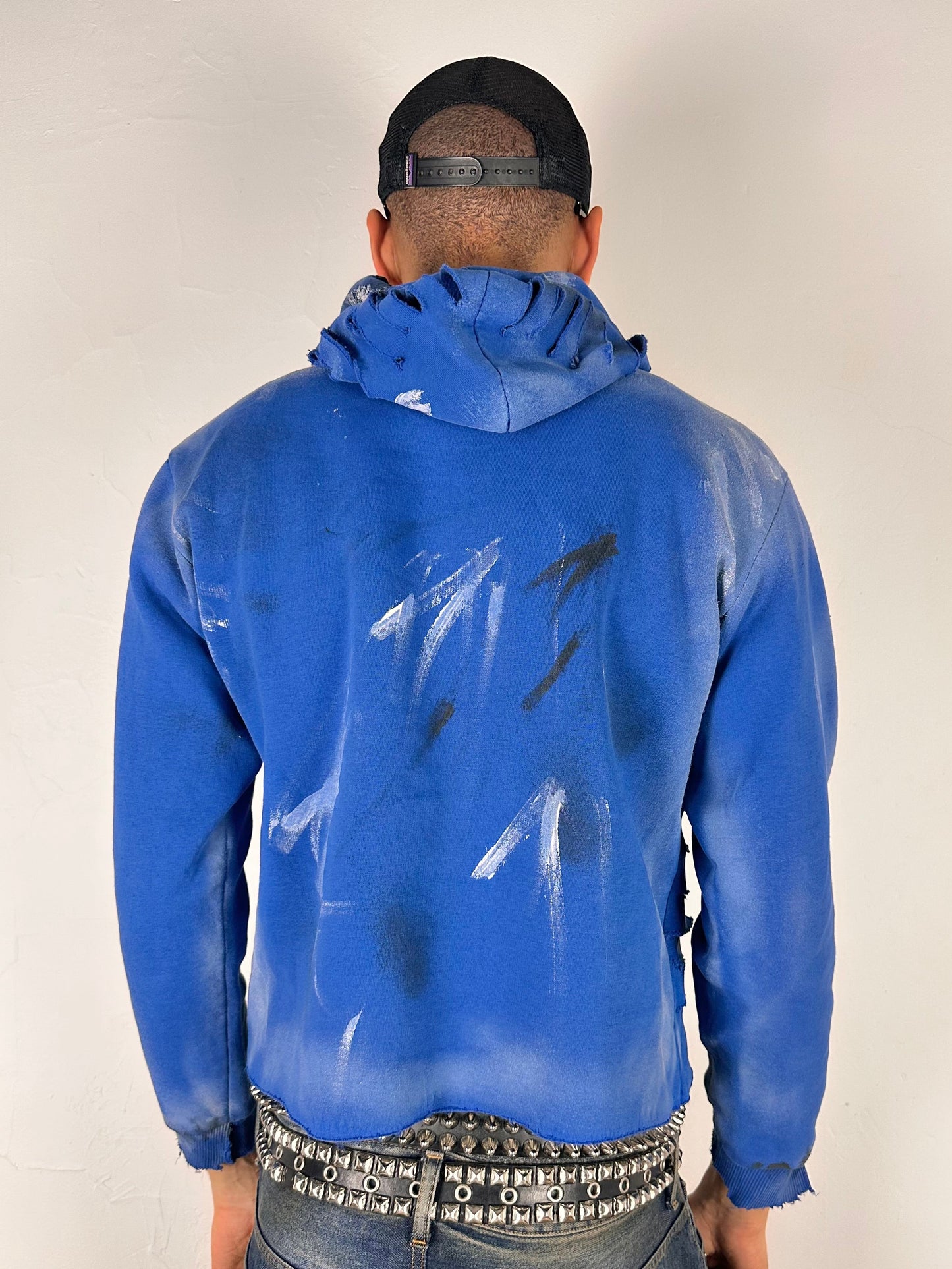Back of ASTROBOI* x Gap blue distressed hoodie with airbrushed logo, ripped detailing, raw hem and rope drawcords, size Large loose fit.