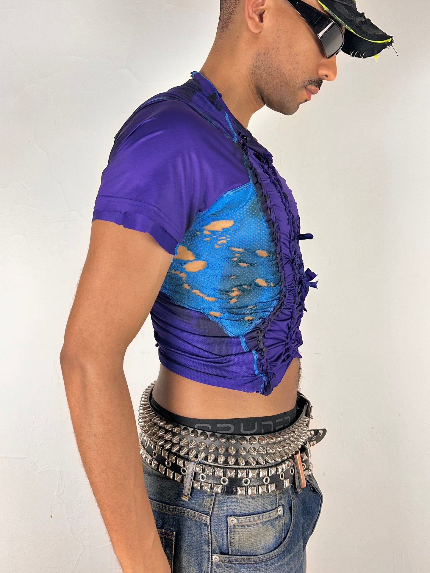 Right side of ASTROBOI* x Under Armour black braided compression top in large with slim stretch fit, twist detailing, and UA logos at chest and back.