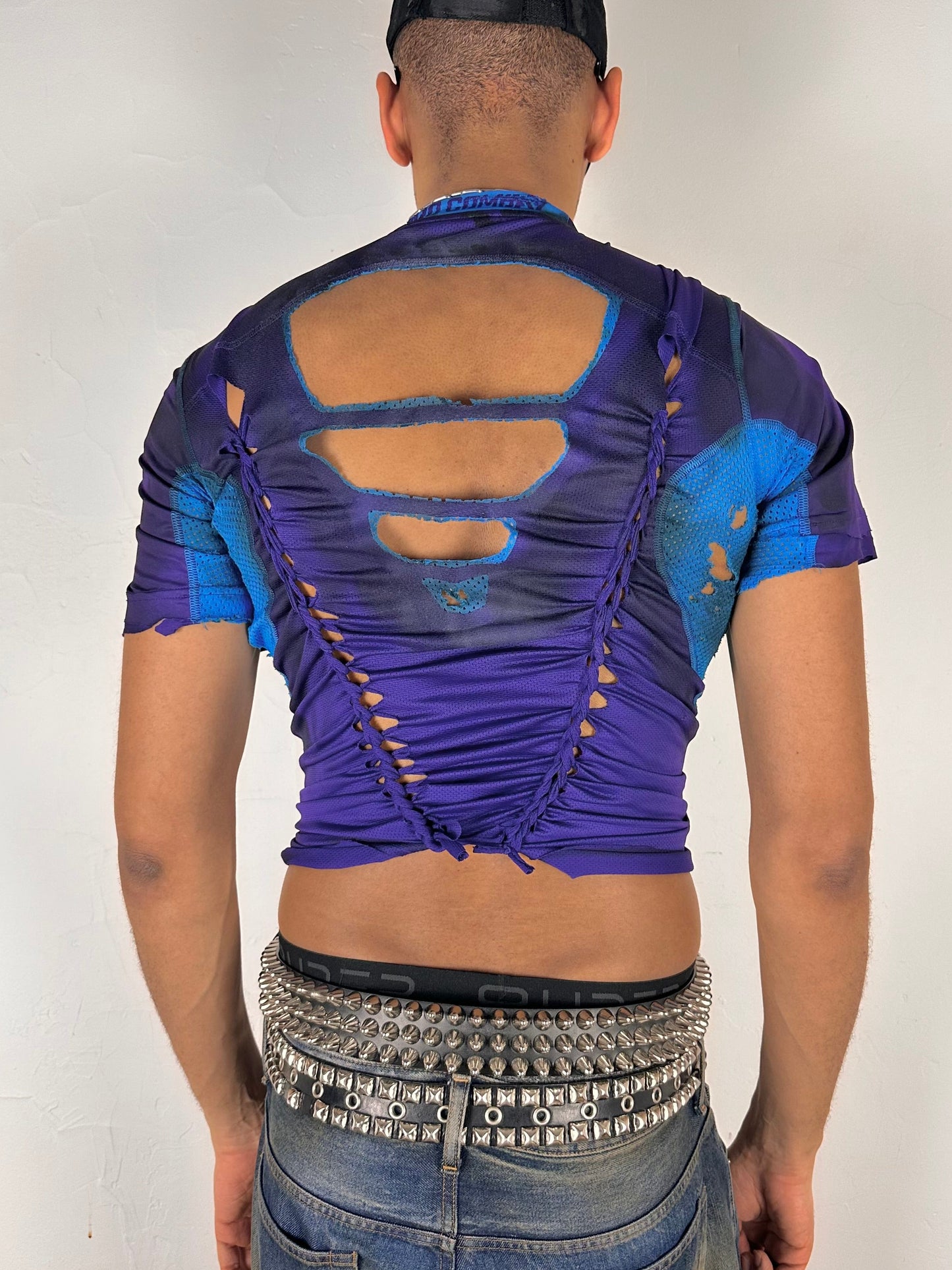 Back of ASTROBOI* x Under Armour black braided compression top in large with slim stretch fit, twist detailing, and UA logos at chest and back.