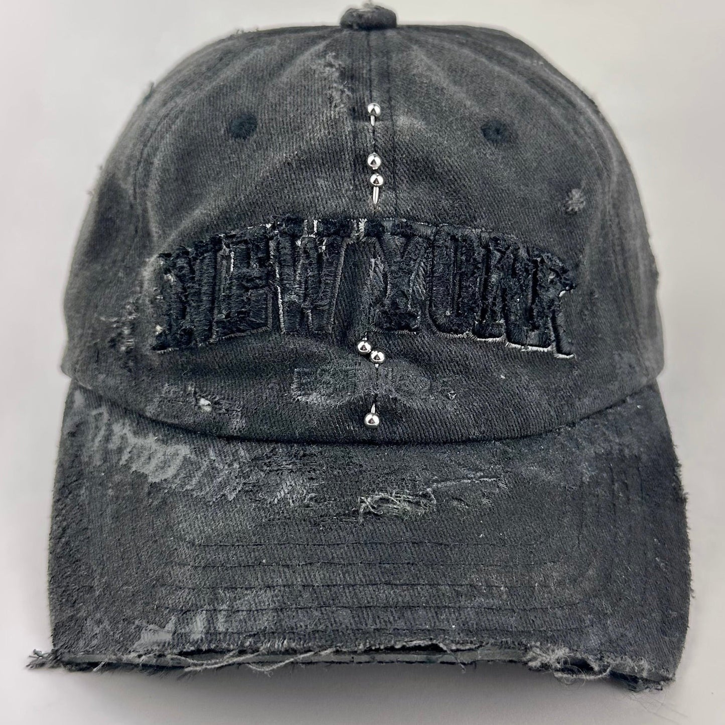 'Kinky' New York Black Distressed Pierced Half Visor Hat