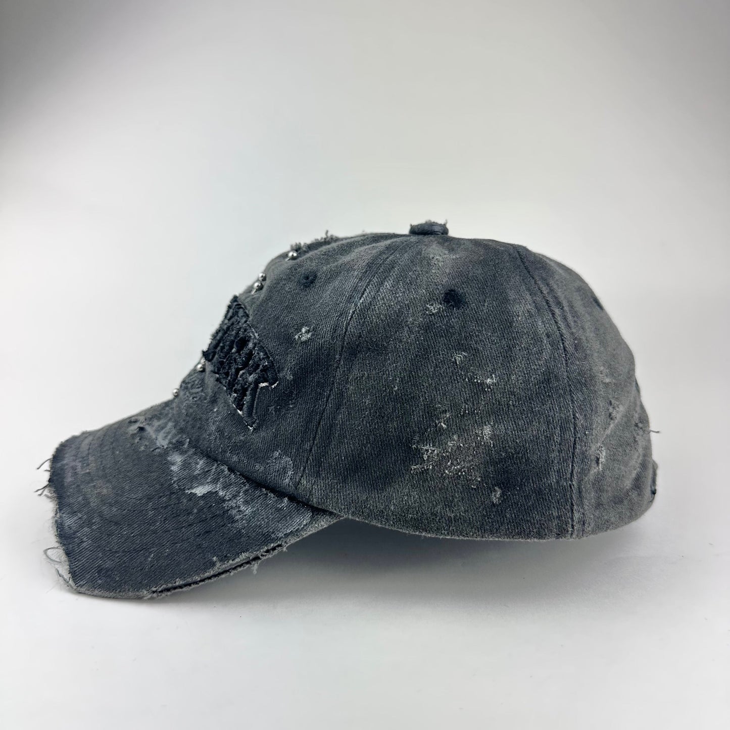 'Kinky' New York Black Distressed Pierced Half Visor Hat