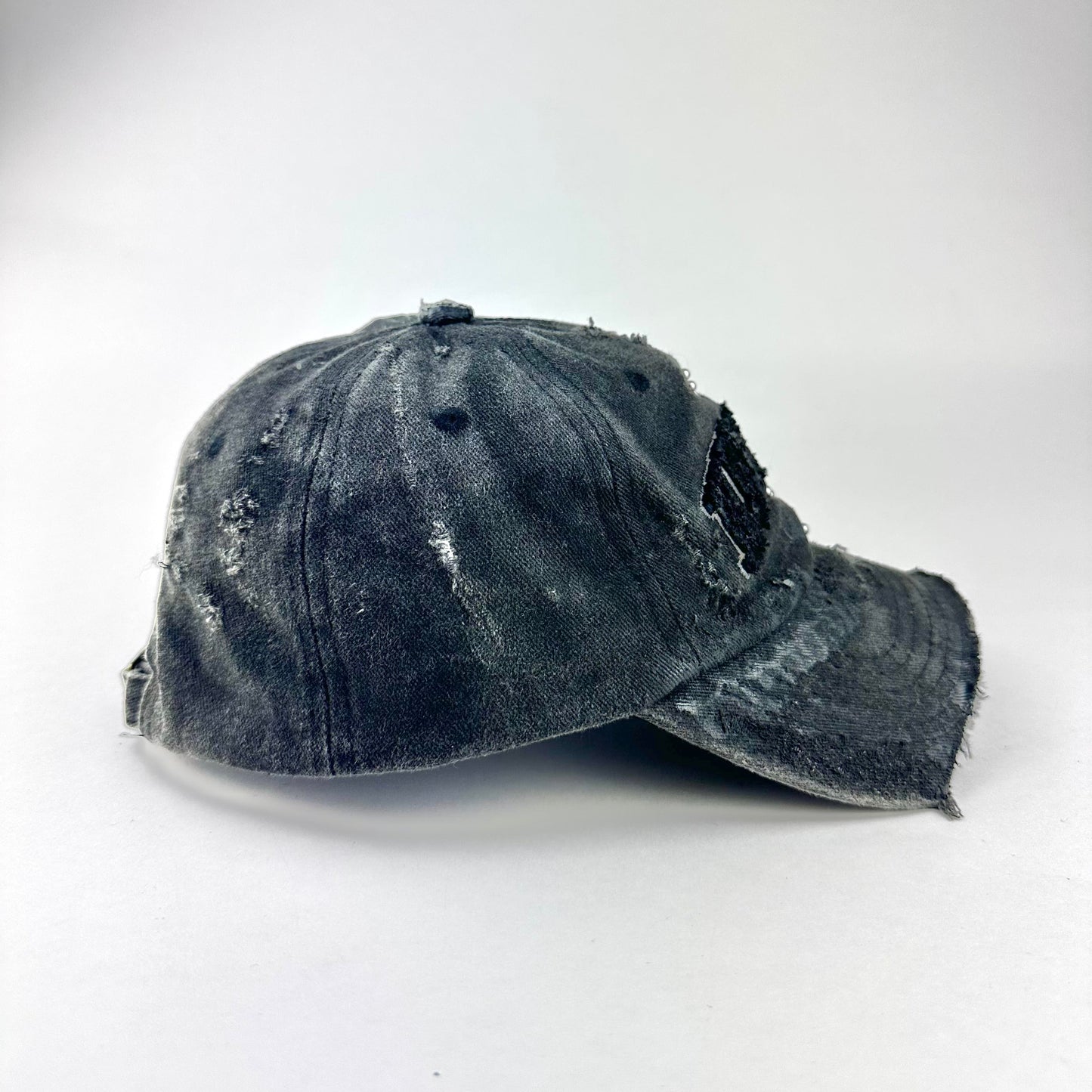 'Kinky' New York Black Distressed Pierced Half Visor Hat