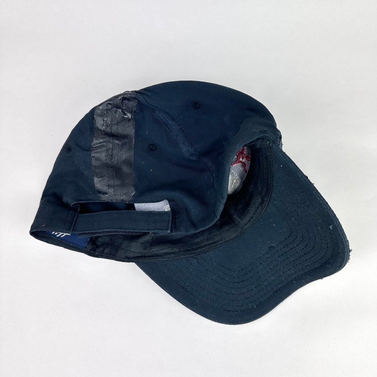 Back product short of ASTROBOI* RBP navy and black distressed utility hat with deconstructed visor, rhinestone logo sealed in resin, adjustable strap, custom NYC piece