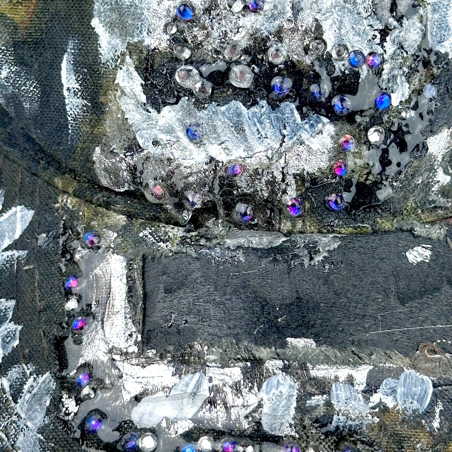 Decorative fabric with crystals and sequins on a black background