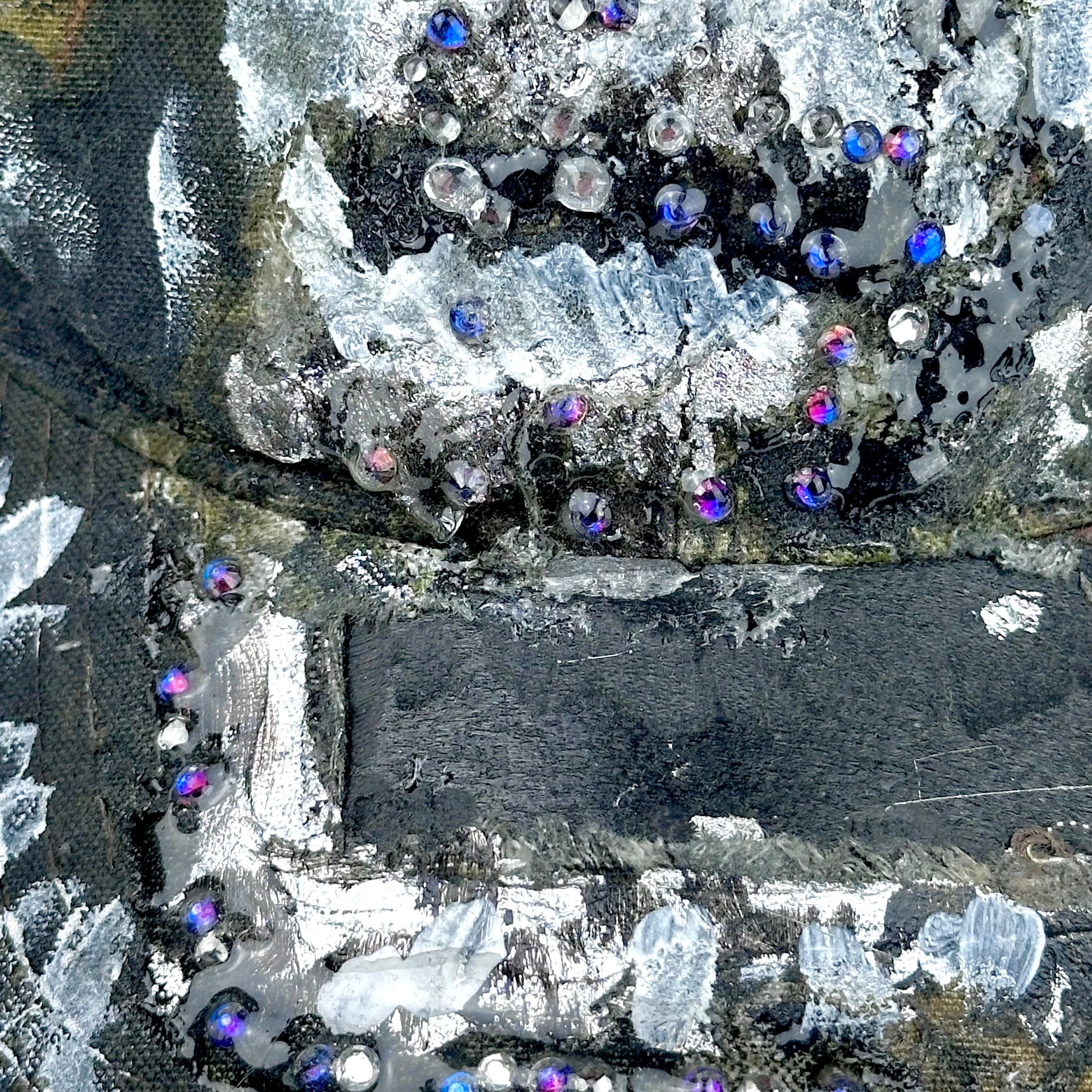 Decorative fabric with crystals and sequins on a black background