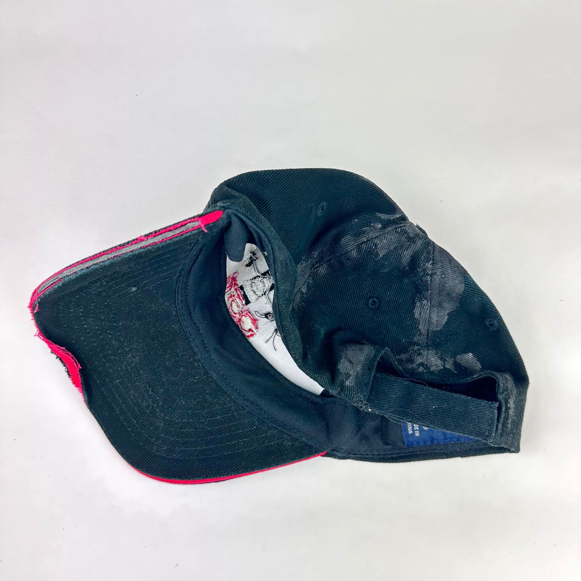 Back product shot of ASTROBOI* C5M Super Galaxy black baseball cap with resin-sealed rhinestone logo patch and adjustable strap, hand-customized in NYC
