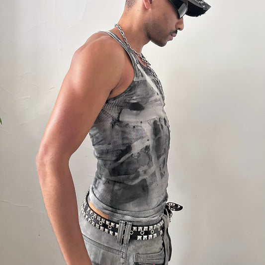 Right side detail of ASTROBOI* x Hanes 'Cobain' showing geometric faded abstract design and raw hemline on slim-fitting white ribbed cotton base.
