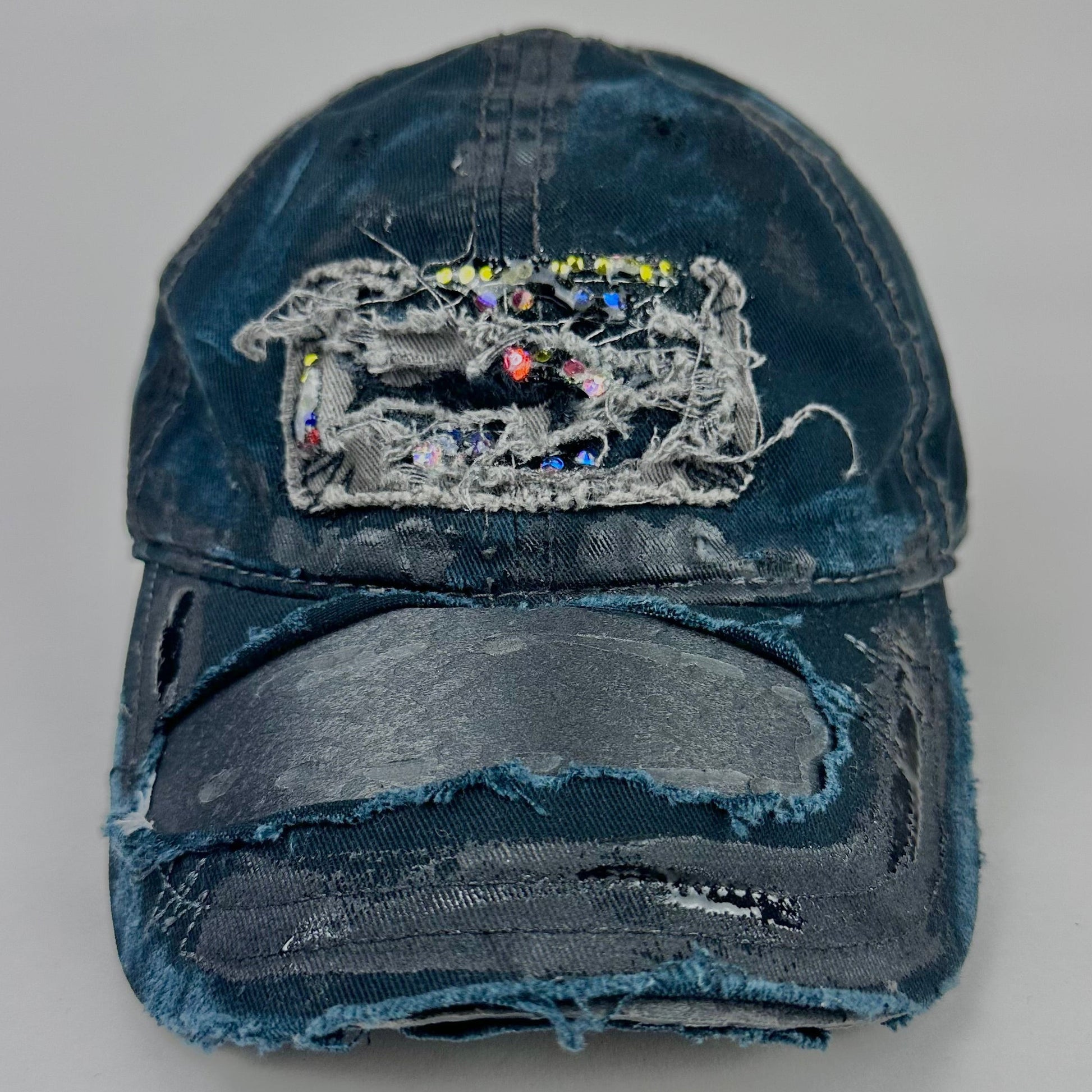 Front product shot of ASTROBOI* New York Aquarium navy distressed baseball hat with resin-sealed rhinestone logo, black waxed paint details, adjustable strap, custom NYC piece