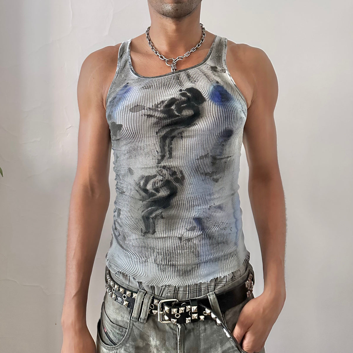 ASTROBOI* x Hanes 'Ice Dancer' white ribbed slim-fitting graphic tank top with blue and black faded tribal tattoo print and raw hemline, front view.