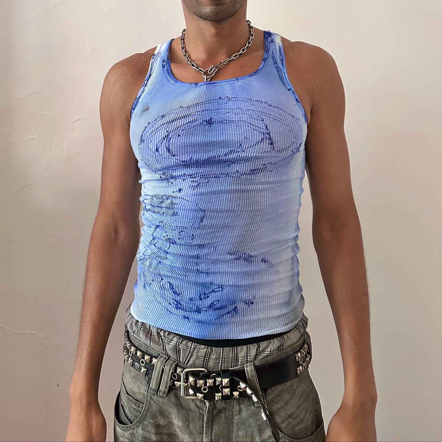 ASTROBOI* x Hanes 'Aero' white ribbed slim-fitting graphic tank top with blue and black faded swirling occult water-like design and raw hemline, front view.
