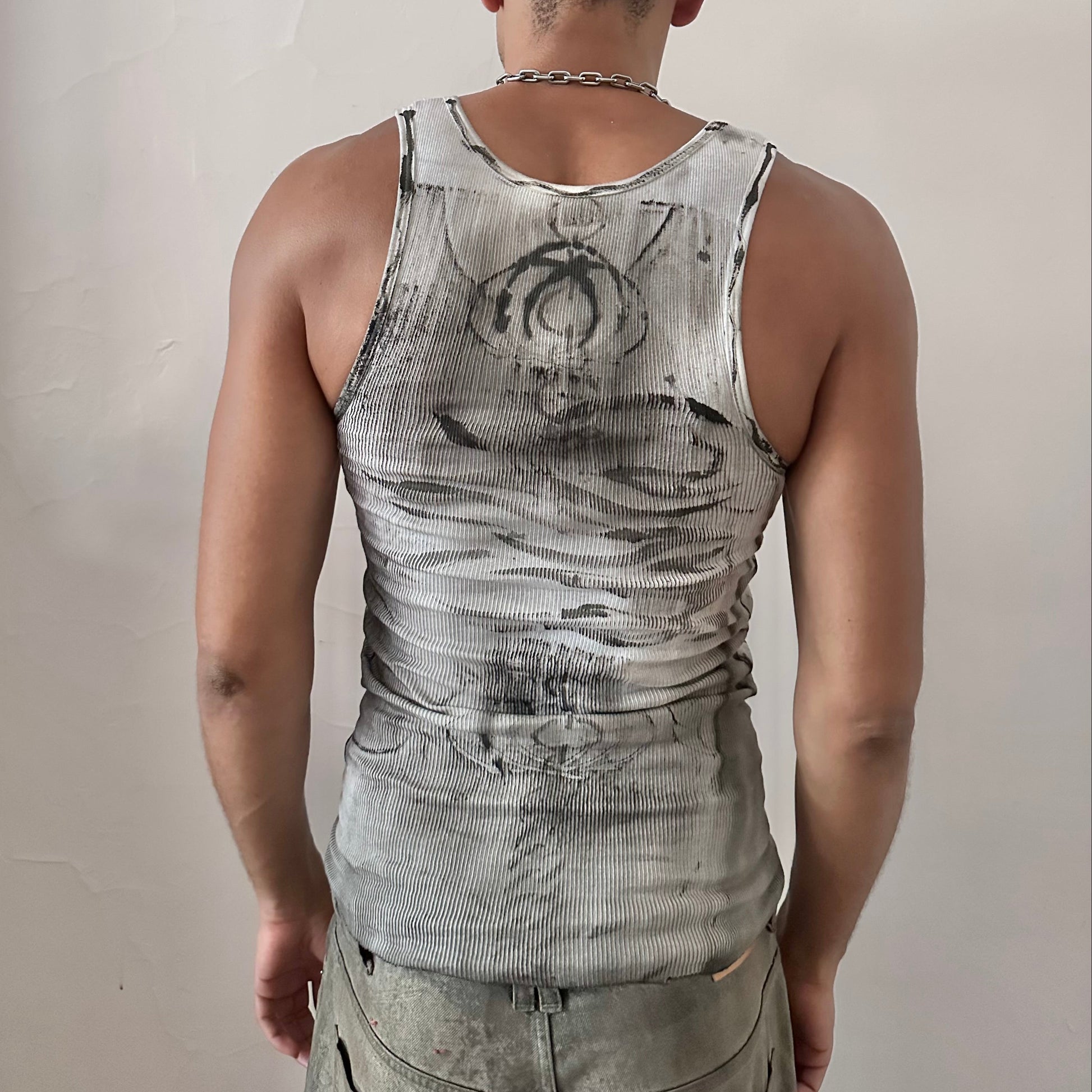 ASTROBOI* x Gildan 'Trace' white and black graphic flame tank top, rear view showing black flame and skull print, worn by male model.