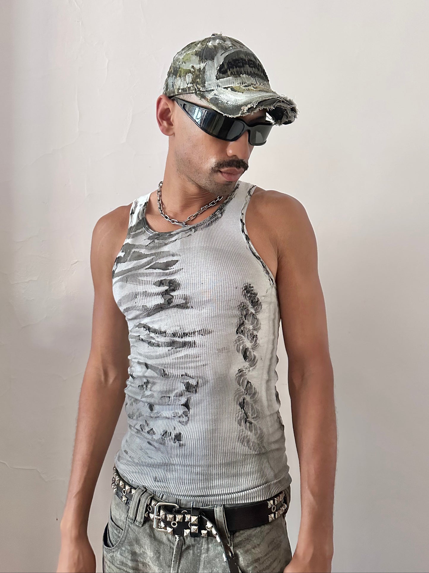 Male model wearing ASTROBOI* x Gildan 'Trace' white and black graphic flame tank top, styled full look, ASTROBOI* STUDIO NYC.
