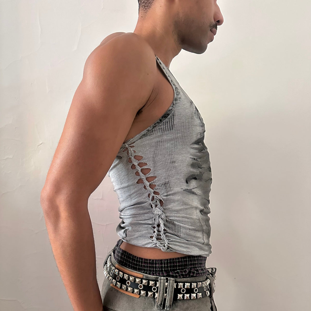 Right side detail of ASTROBOI* x Hanes 'Svartalfa' showing side braid construction and black faded flame design on gray faded cotton base.
