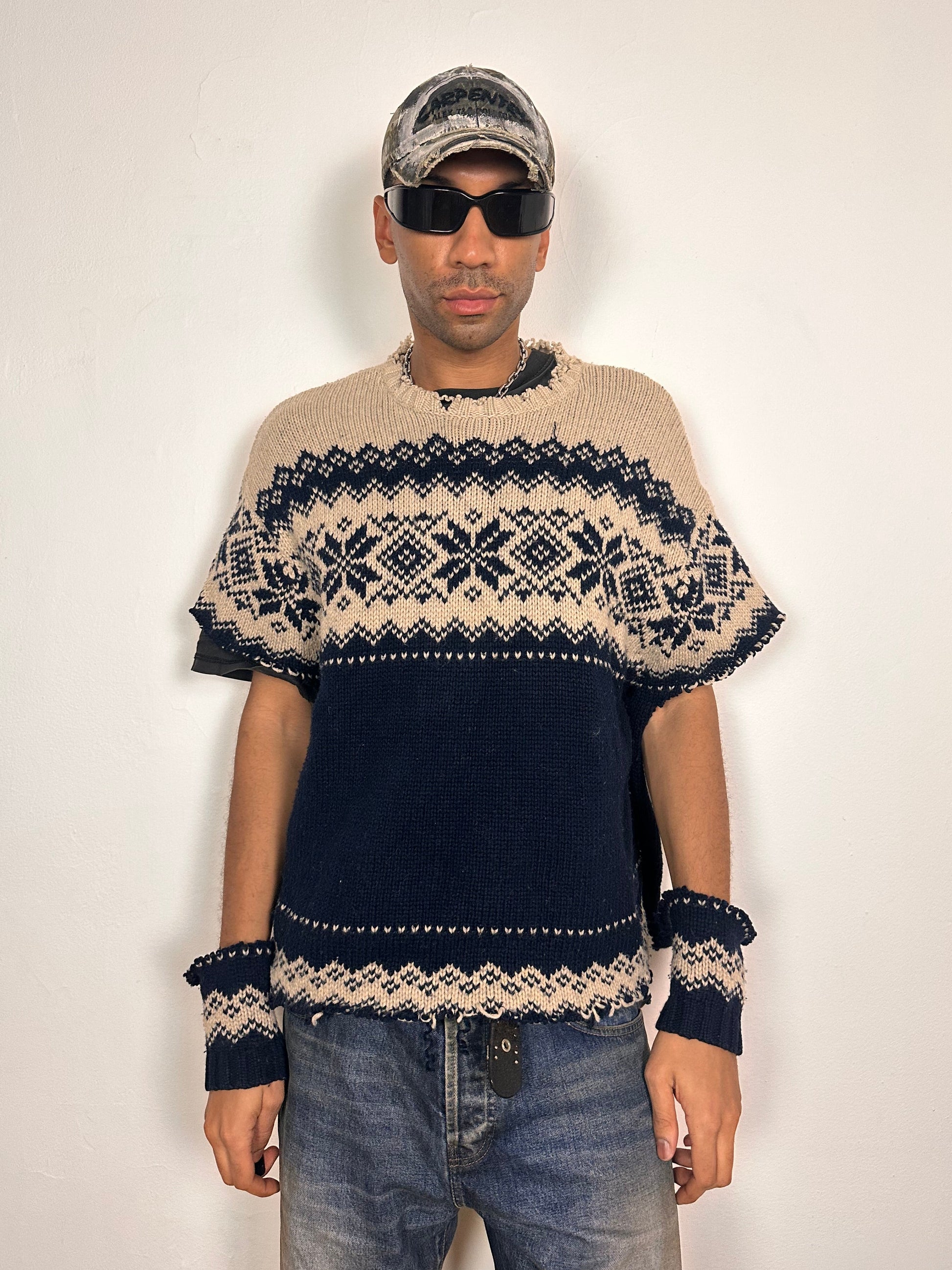 Styled view of Deconstructed Fair Isle grunge sweater in XL with boxy fit, cutout sleeves, and raw hem, handmade by ASTROBOI* STUDIO in NYC.