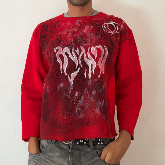 ASTROBOI* x Russell ‘Red Wave’ red boxy-fit graphic print sweatshirt with washed out black digital camo print and white Y2K flame winged design, raw hemline, front view.
