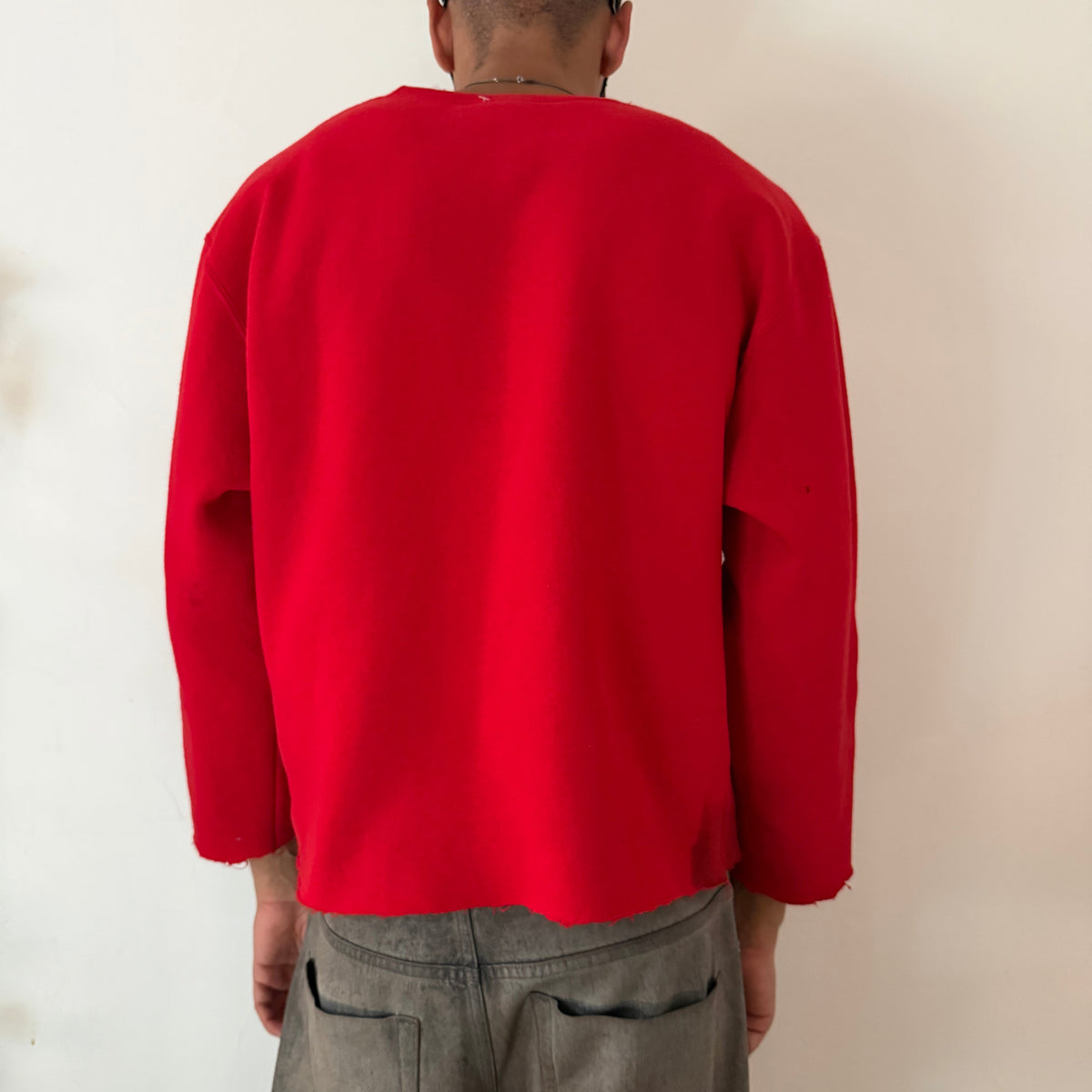 ASTROBOI* x Russell ‘Red Wave’ red cotton graphic print sweatshirt, rear view showing black digital camo and white flame winged design, worn by male model.