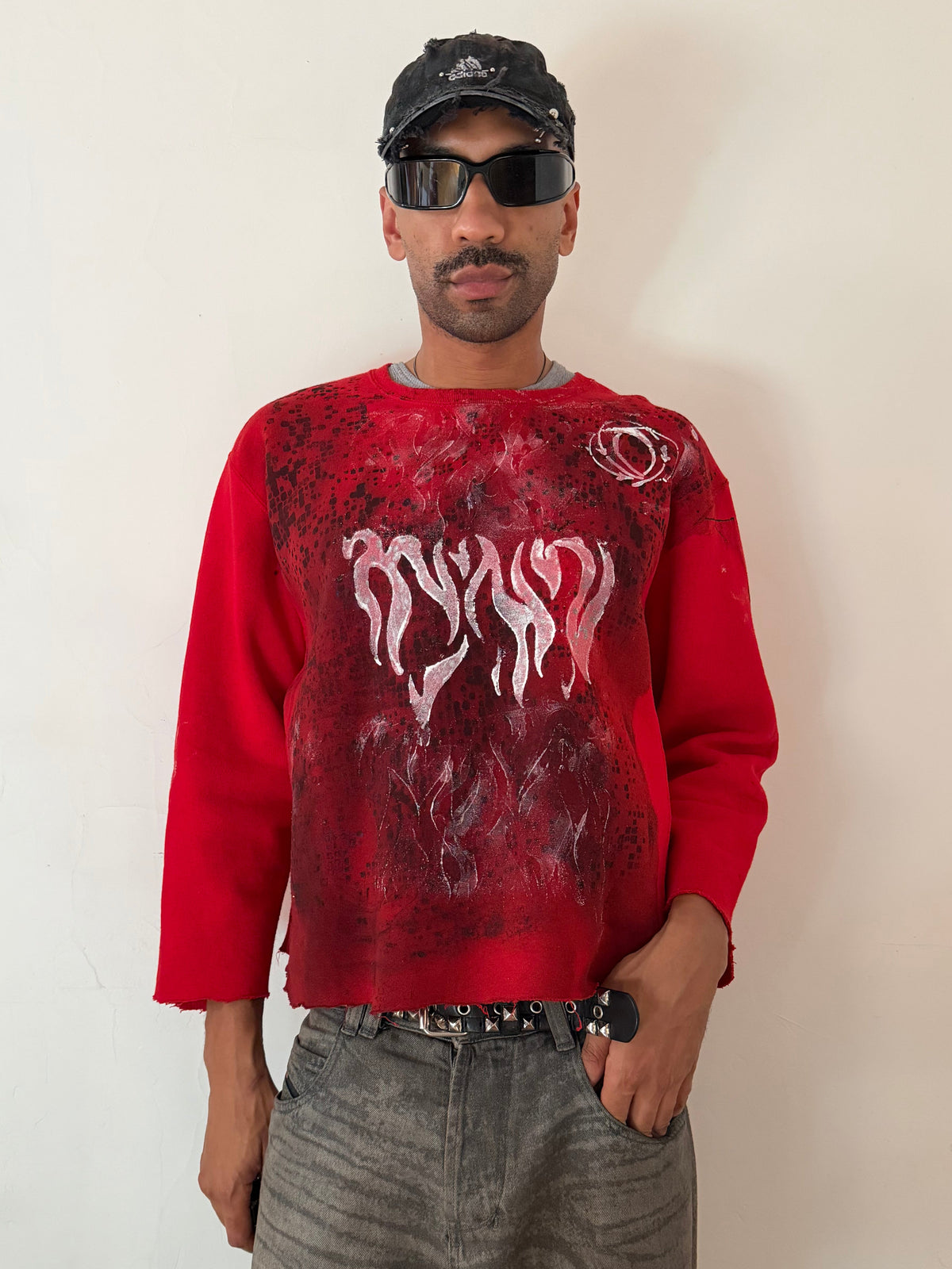 Male model wearing ASTROBOI* x Russell ‘Red Wave’ red cotton graphic print sweatshirt, styled full look, ASTROBOI* STUDIO NYC.