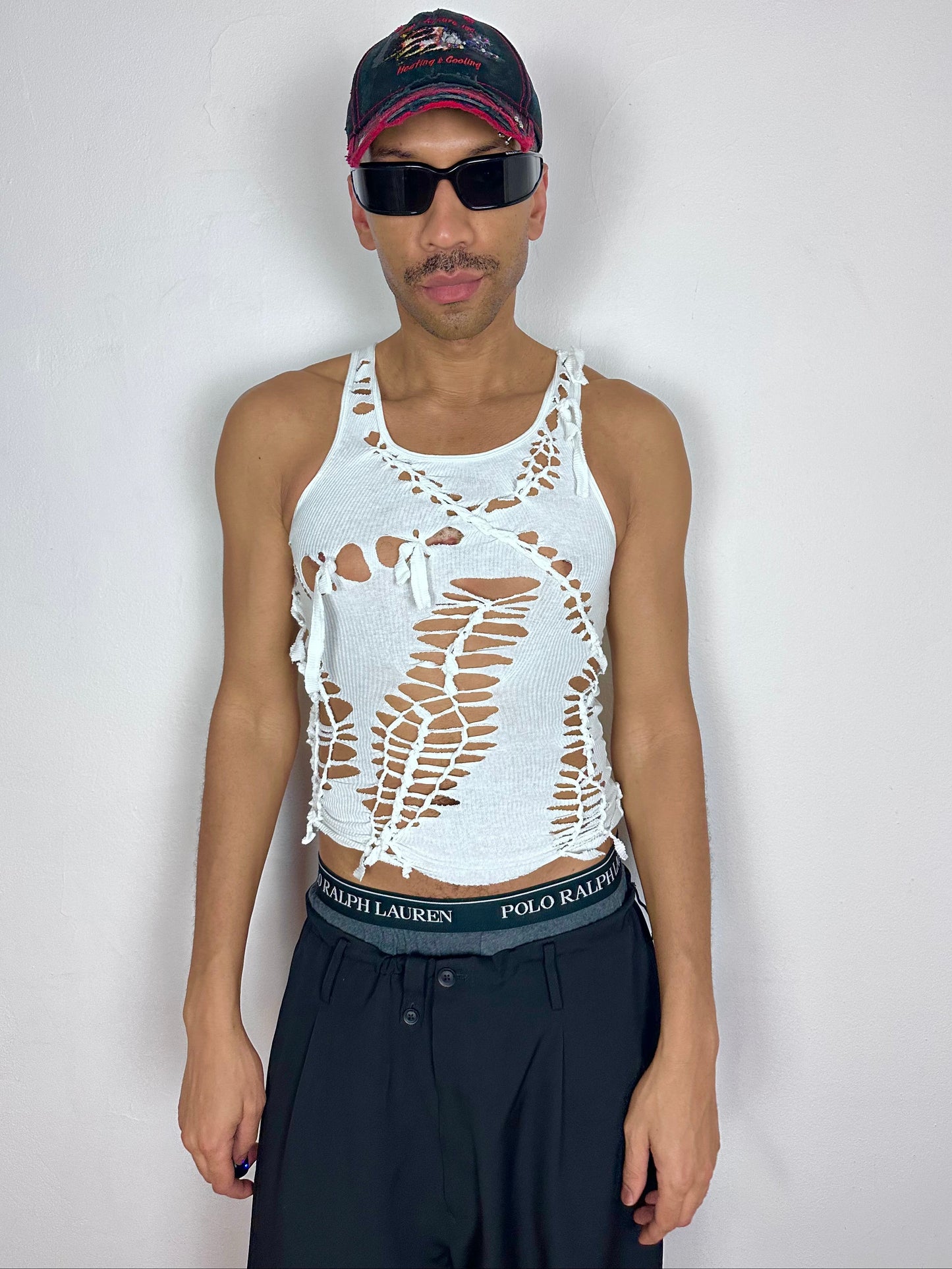 Male model wearing ASTROBOI* x Hanes 'Cosmo' white braided sleeveless tank top, styled full look, ASTROBOI* STUDIO NYC.