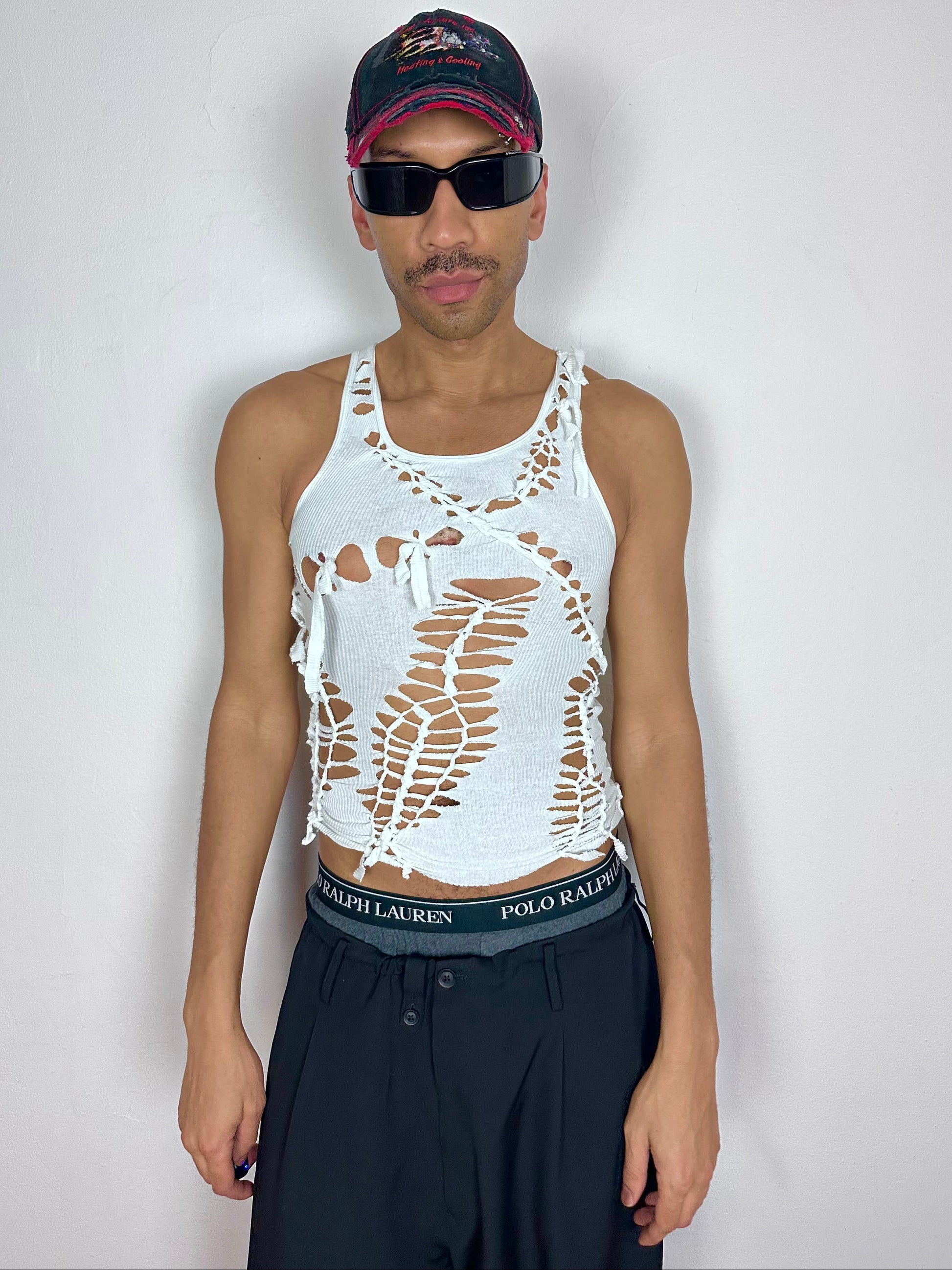 Male model wearing ASTROBOI* x Hanes 'Cosmo' white braided sleeveless tank top, styled full look, ASTROBOI* STUDIO NYC.