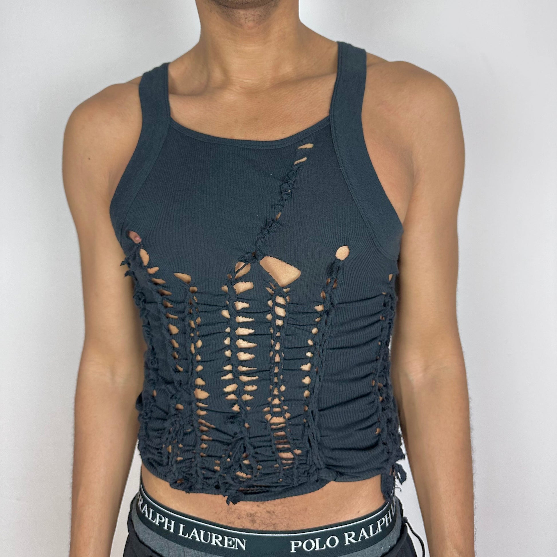 ASTROBOI* 'Abstract' black form-fitting Y2K braided cut out tank top with intricate hand-braided twists and cut-outs along the front, G-Unit inspired silhouette, front view.