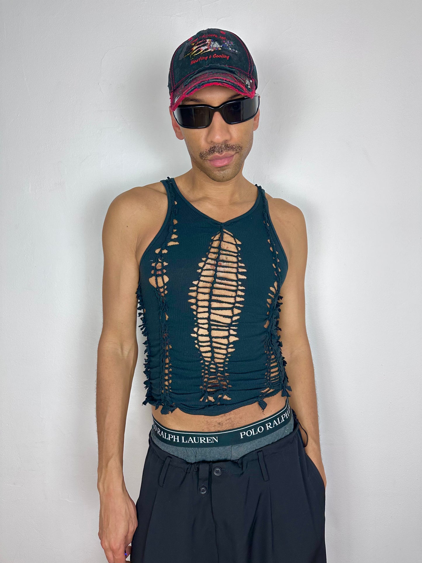 Male model wearing ASTROBOI* 'Jet' black braided twist tank top, styled full look, ASTROBOI* STUDIO NYC.