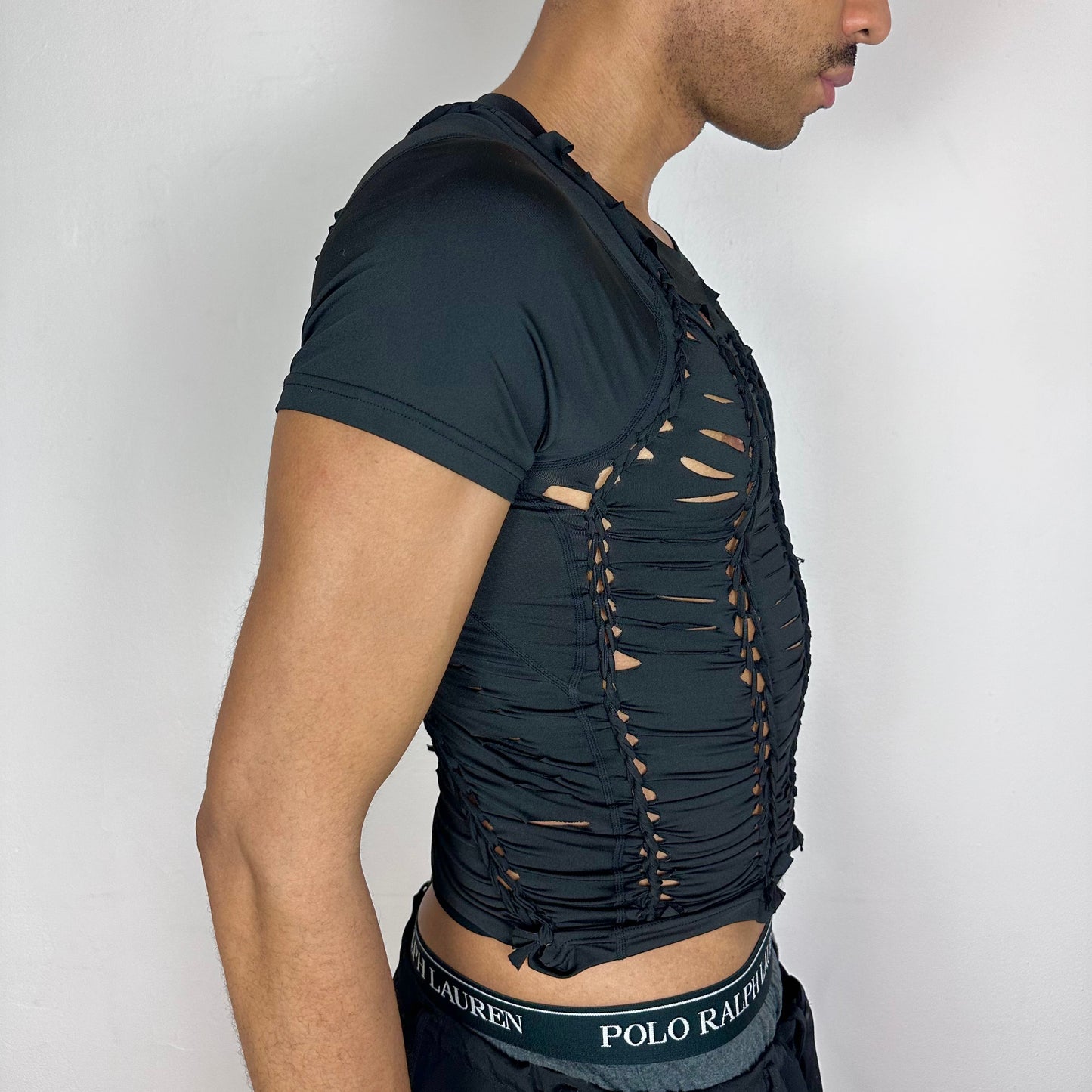 Right side detail of ASTROBOI* 'Lines' showing braided construction on form-fitting black compression base.