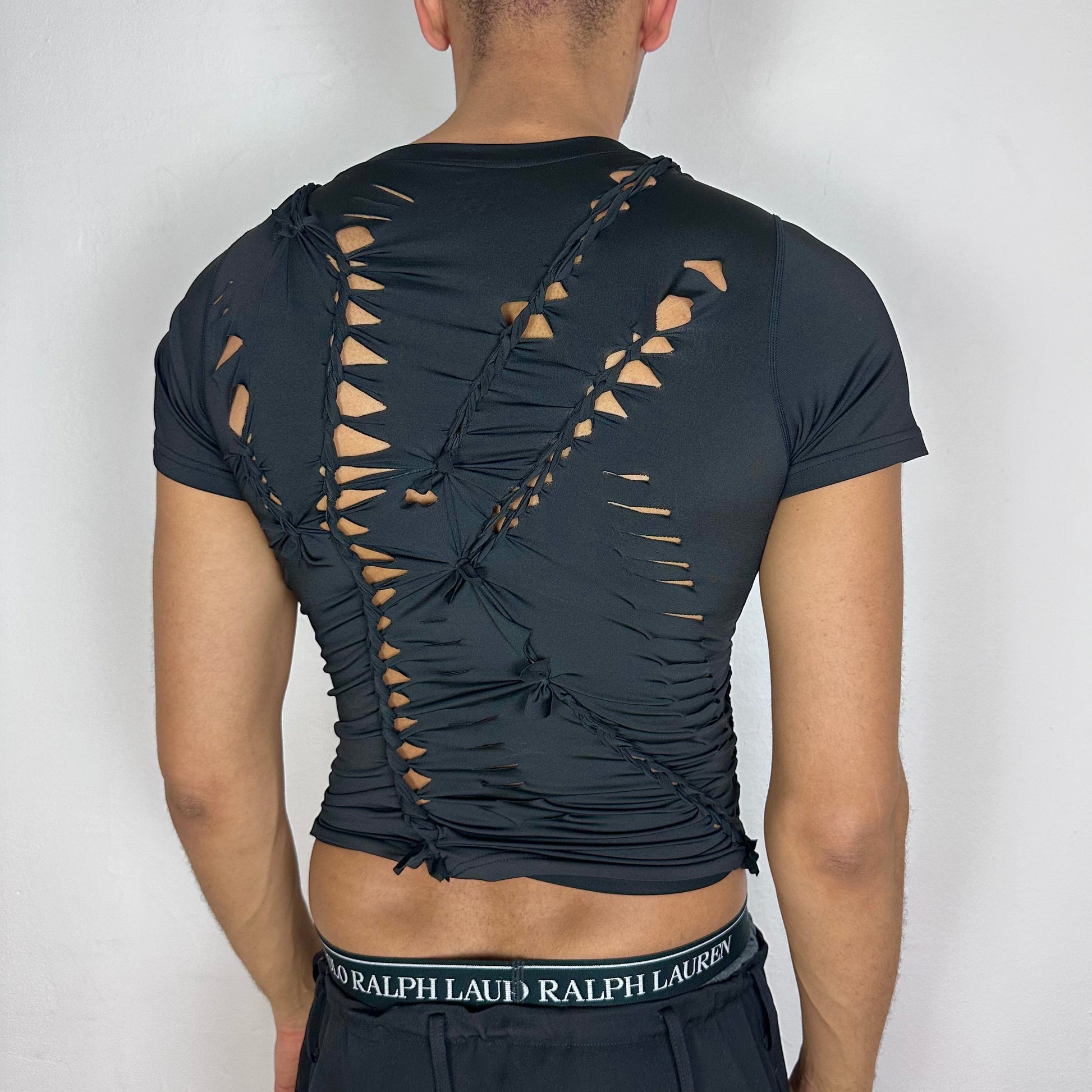 ASTROBOI* 'Lines' black braided compression shirt, rear view showing braid construction, worn by male model.