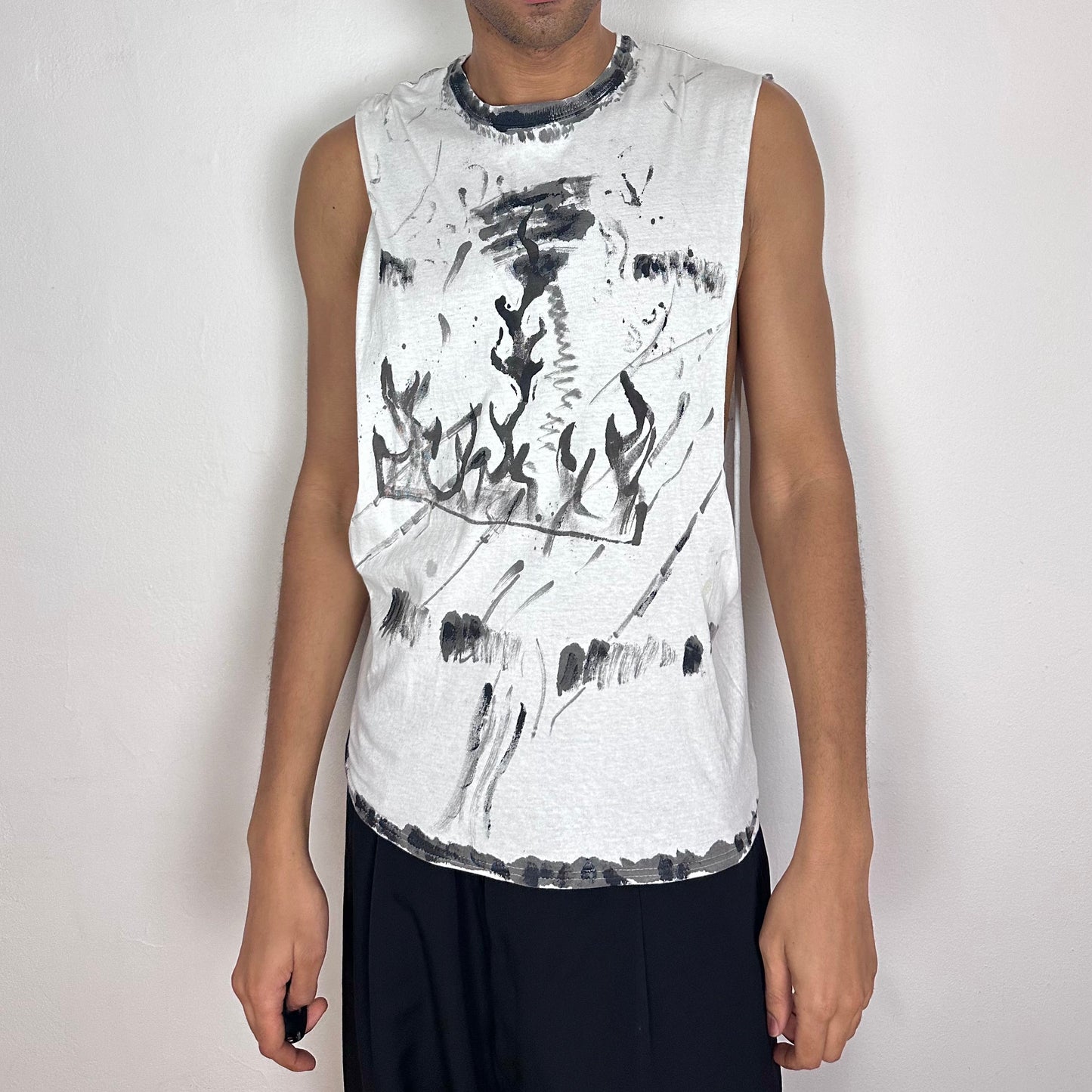 ASTROBOI* x Hanes 'Flames' white loose-fitting muscle shirt with hand-drawn black scribbles and flame tattoo print throughout, large armholes, front view.
