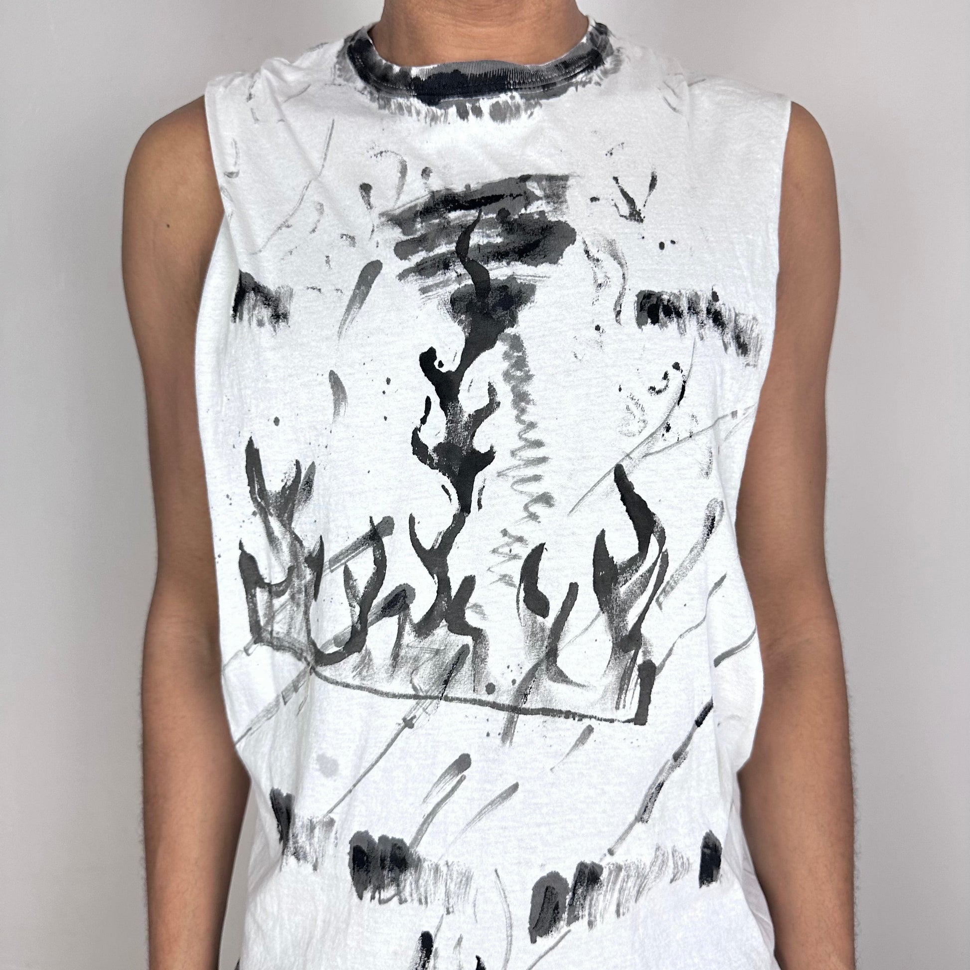 Close-up of ASTROBOI* x Hanes 'Flames' showing hand-drawn black scribble detailing and flame tattoo print with subtle distressing on white fabric.