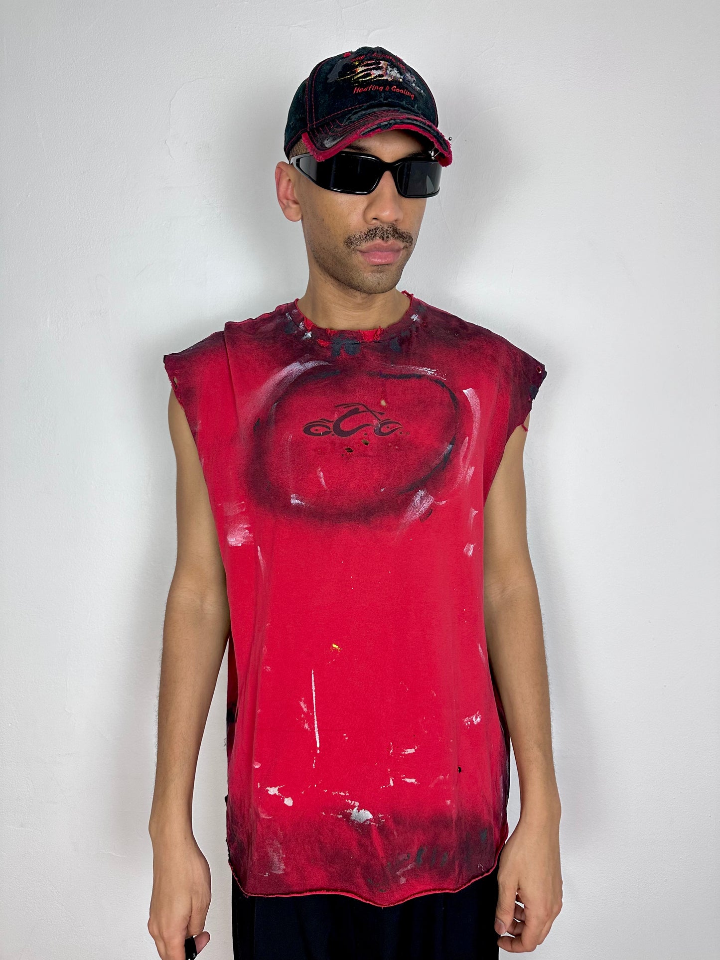 Male model wearing ASTROBOI* Y2K Orange County Choppers red painted muscle tank top, styled full look, ASTROBOI* STUDIO NYC.
